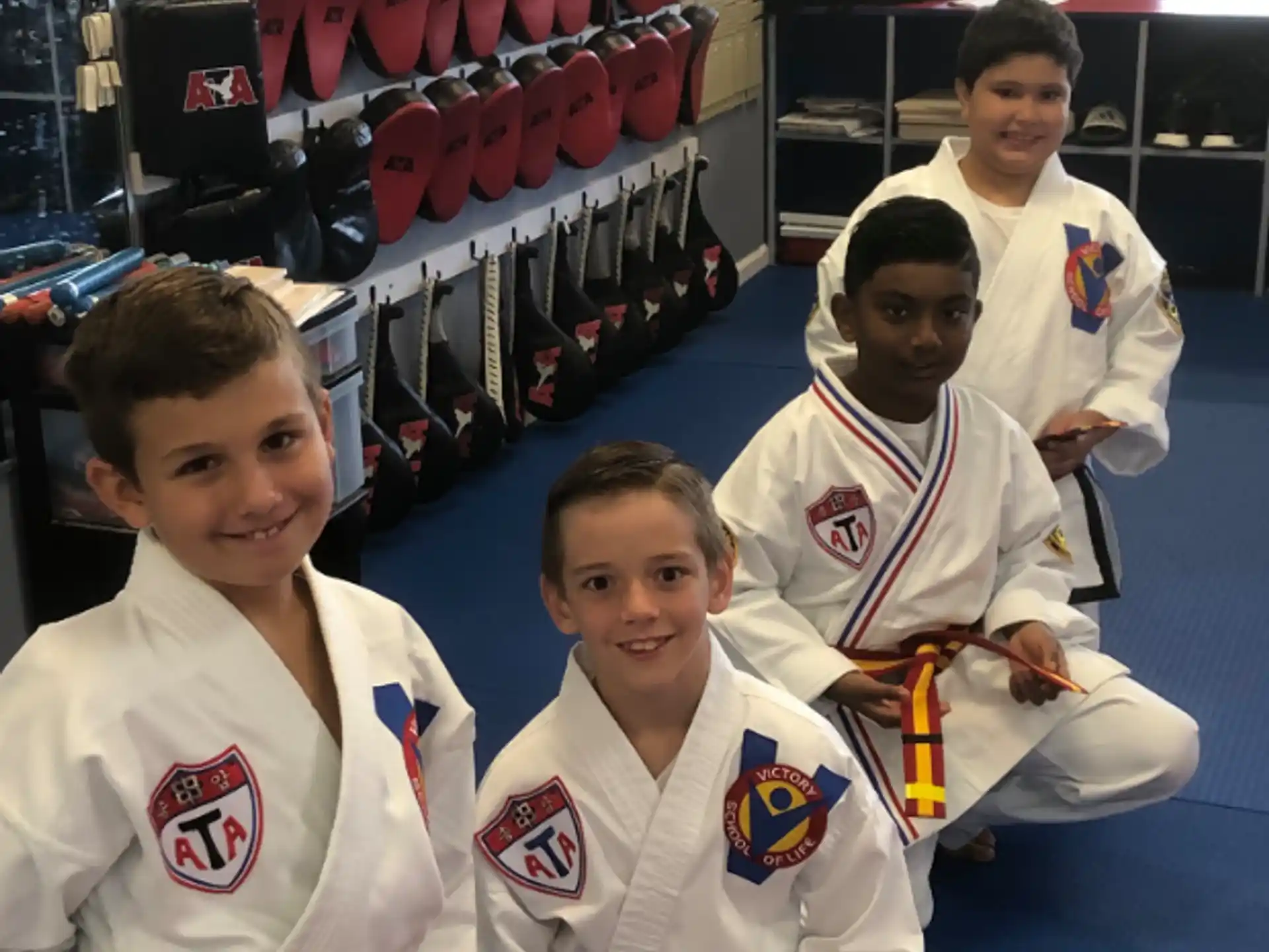 a group of boys in white uniforms