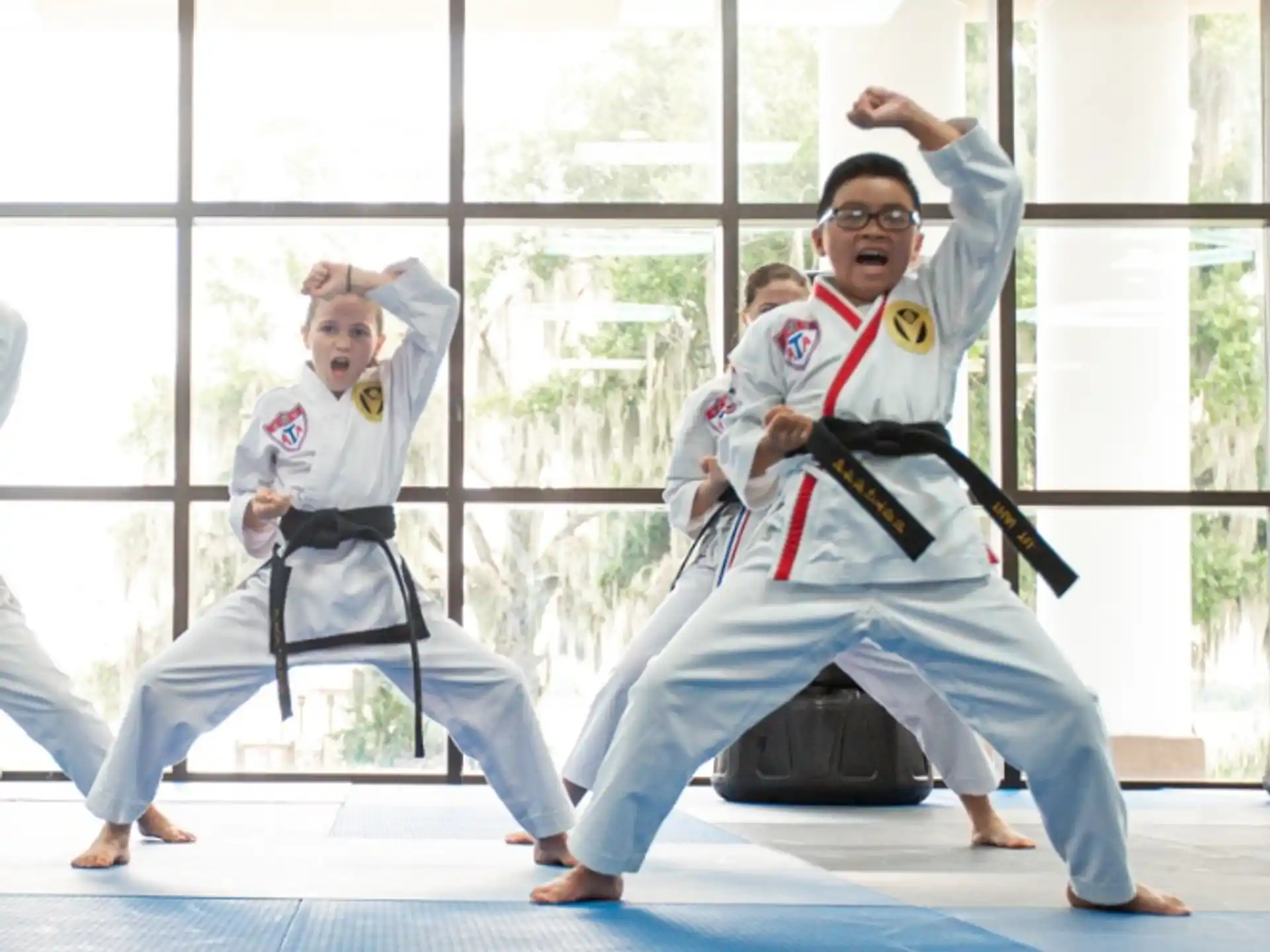 a group of people in karate uniforms