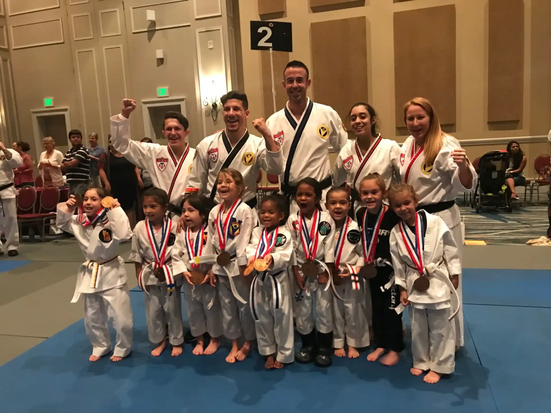 a group of people in karate uniforms