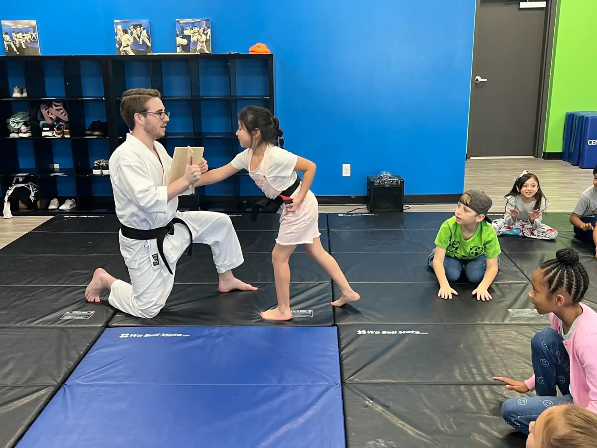 a man and a woman practicing martial arts