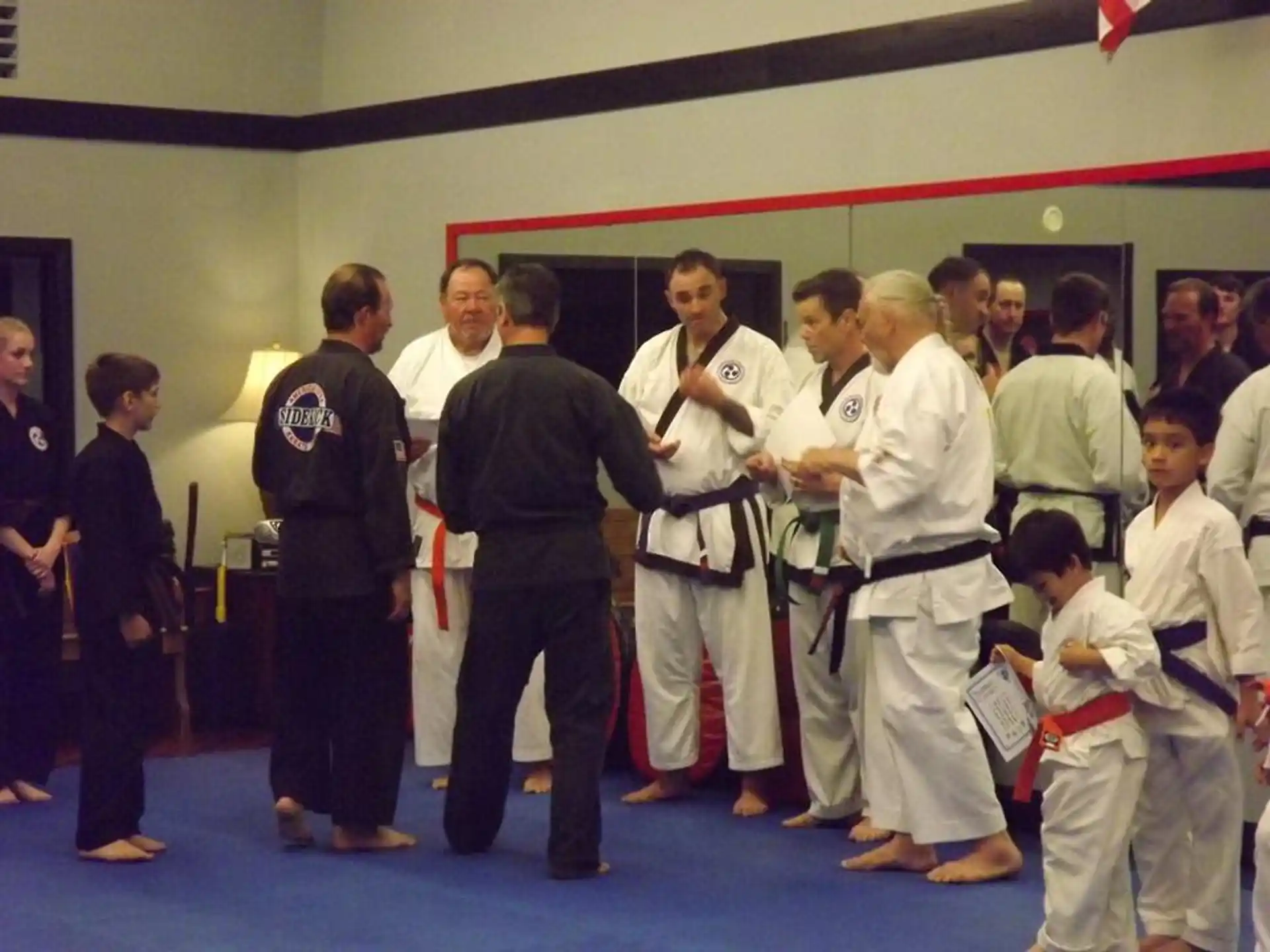 a group of people in karate uniforms