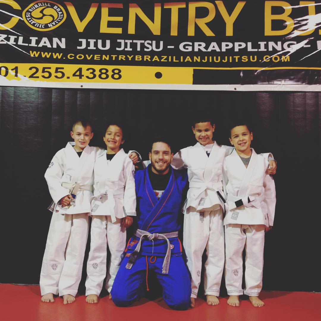 a group of people in karate uniforms