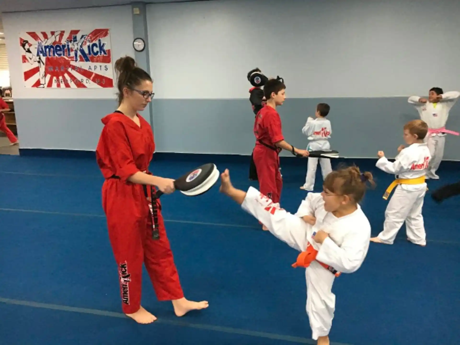a group of people in karate uniforms