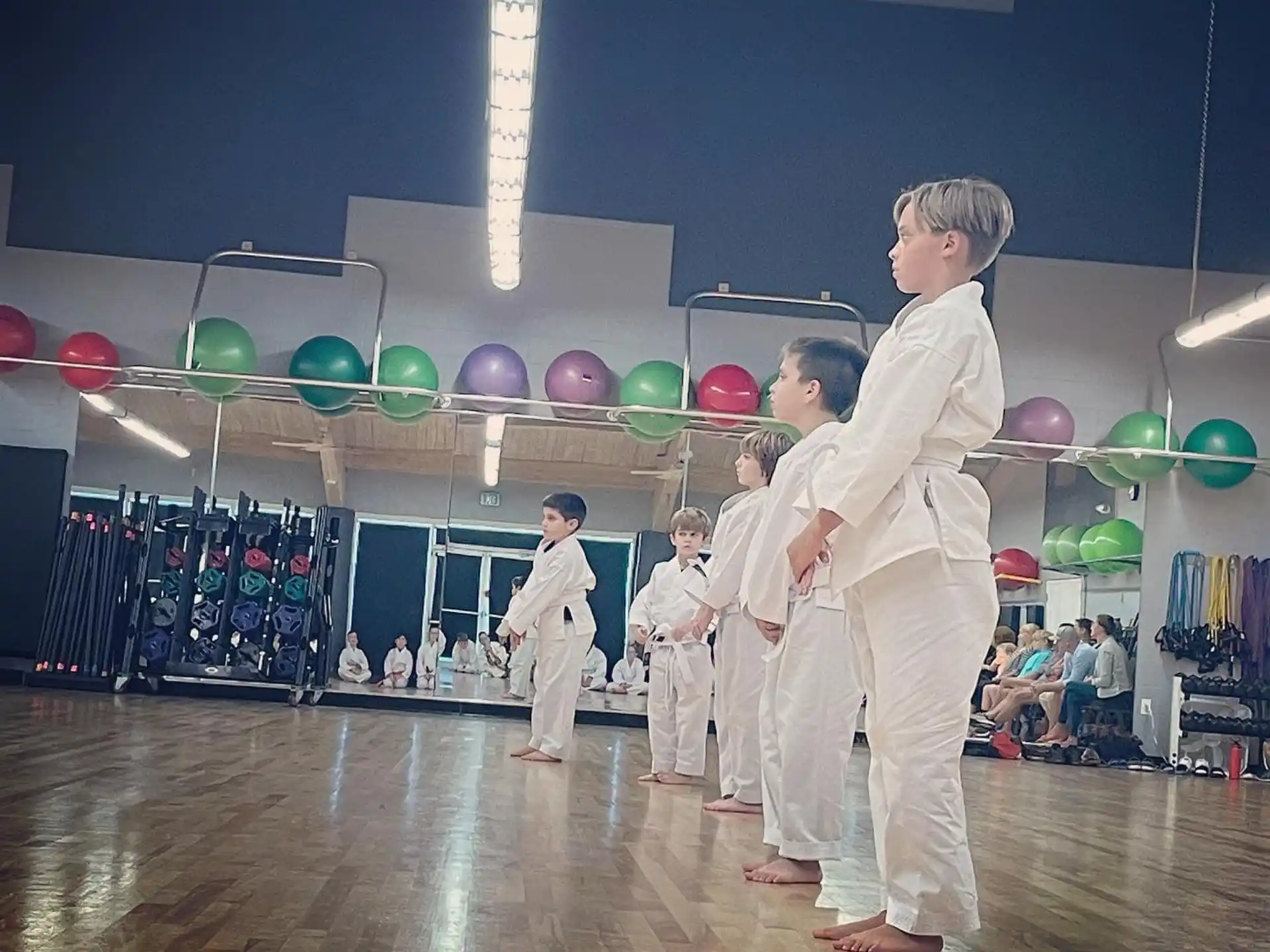 a group of people in karate uniforms