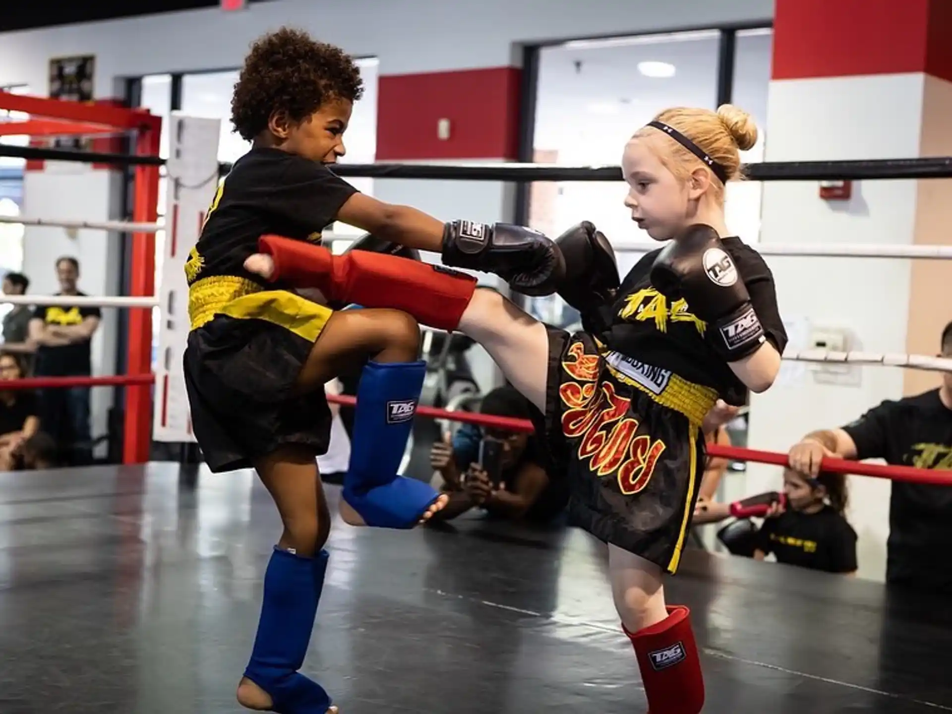 a group of women in a boxing ring