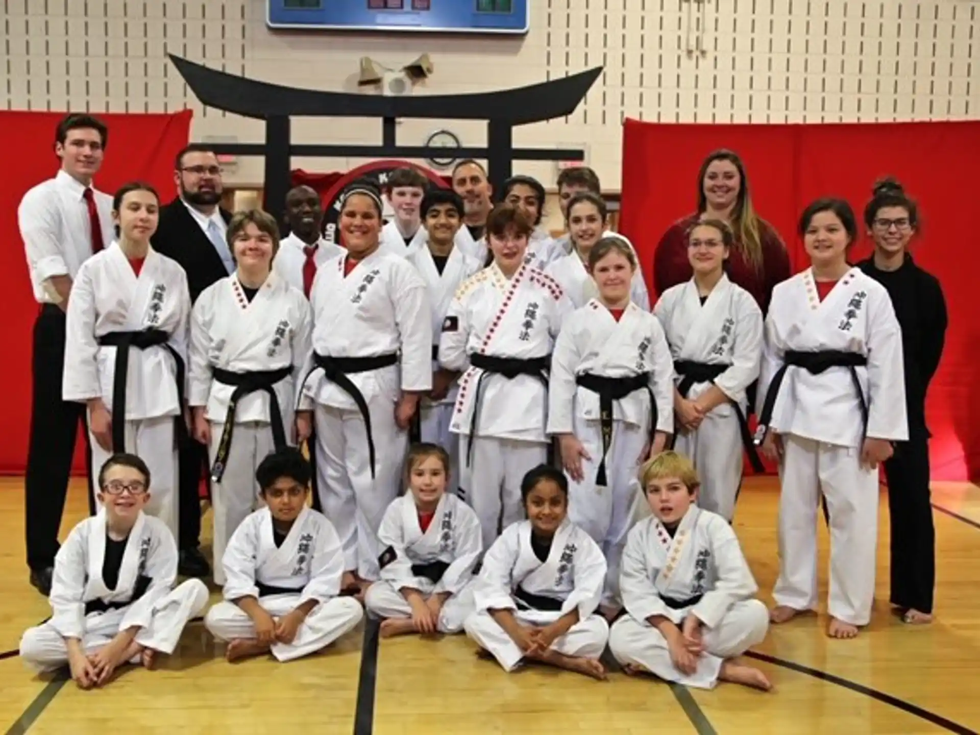 a group of people in karate uniforms