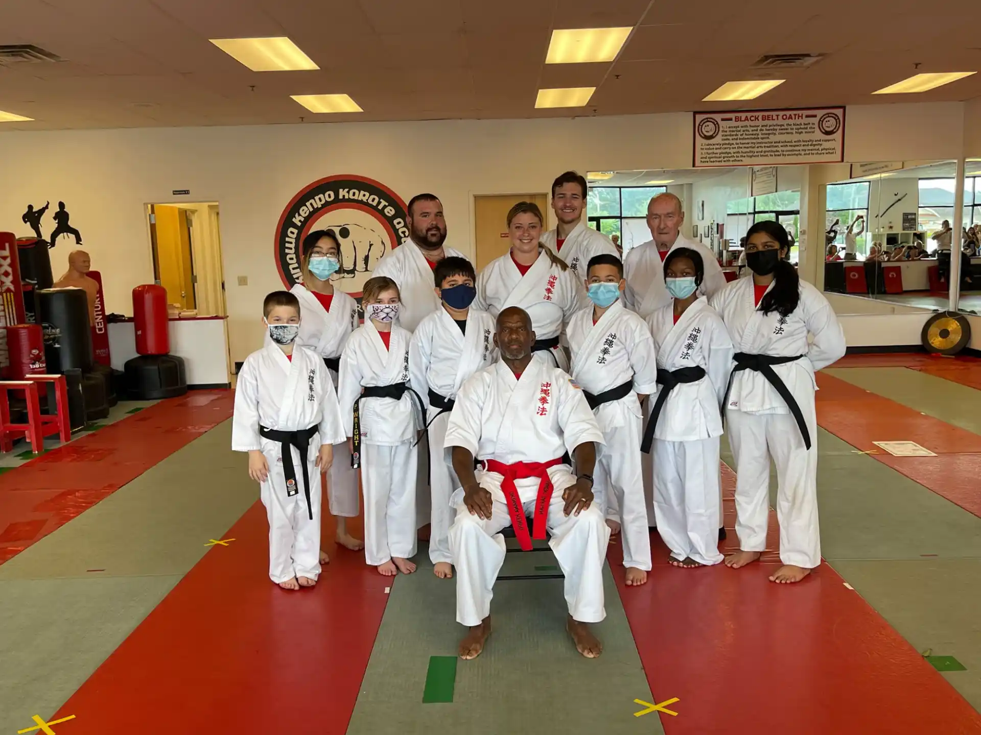 a group of people in karate uniforms