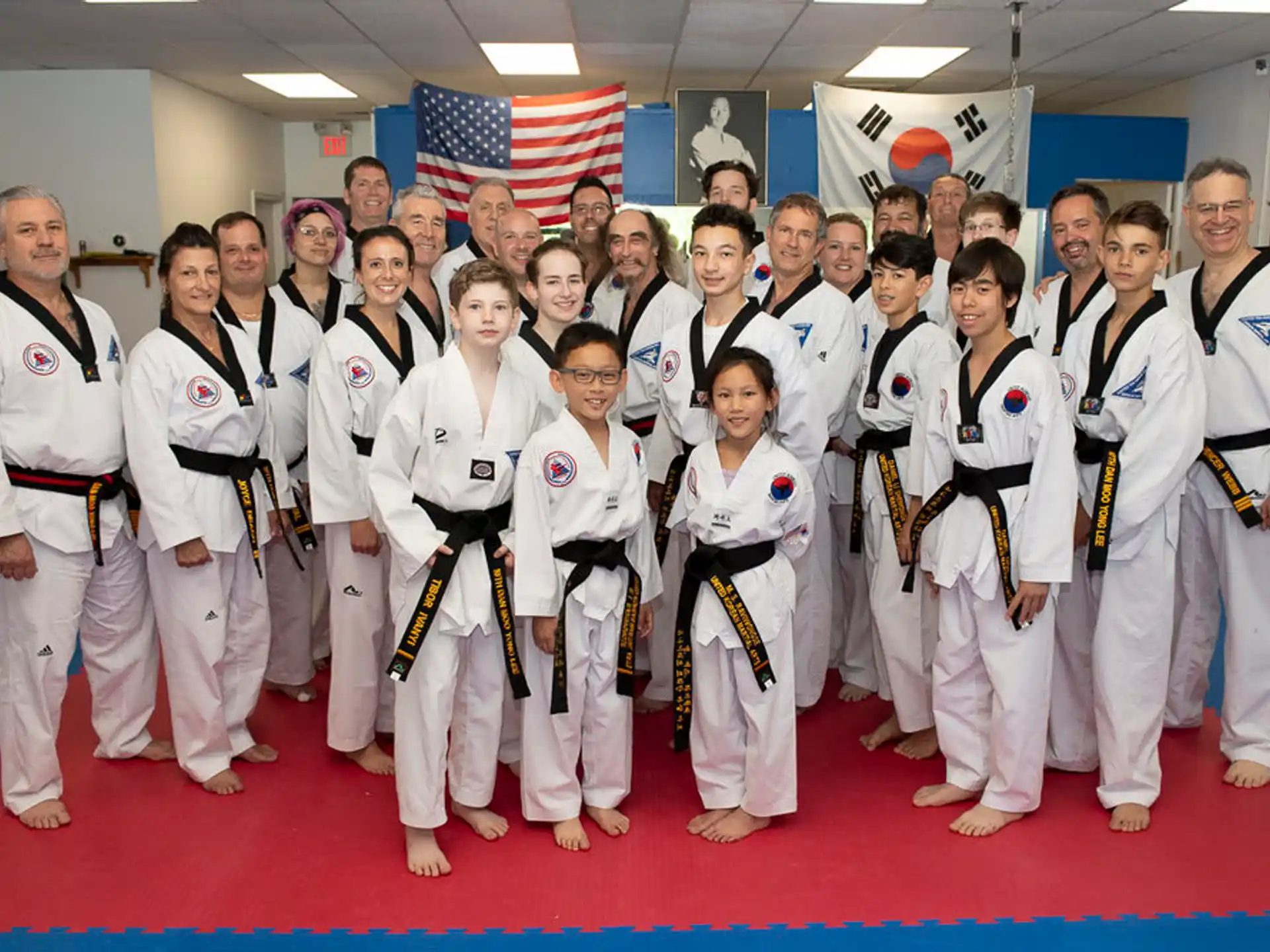 a group of people in karate uniforms