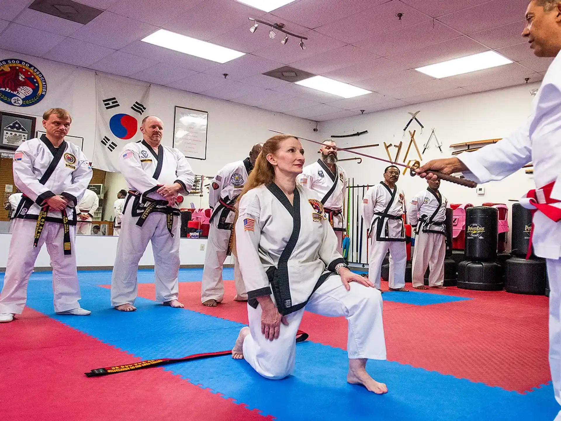 a group of people in karate uniforms