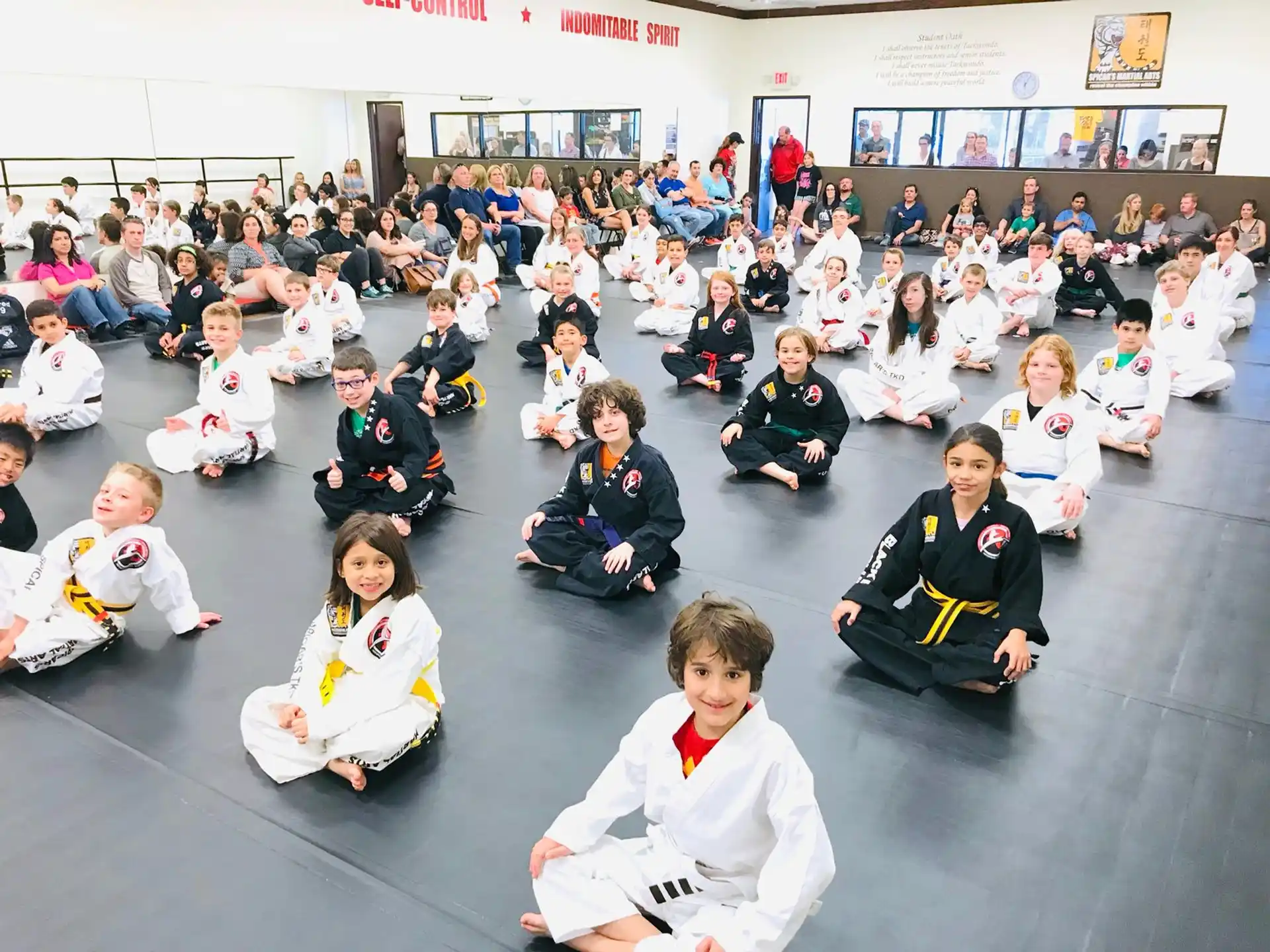 a group of people sitting on the floor