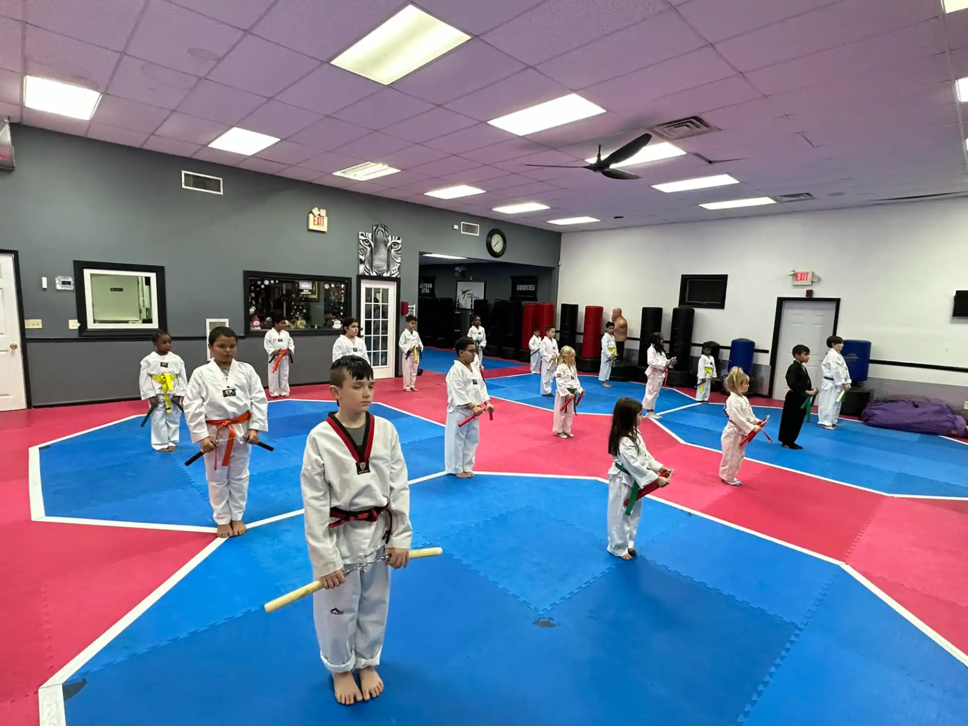a group of people in a karate class