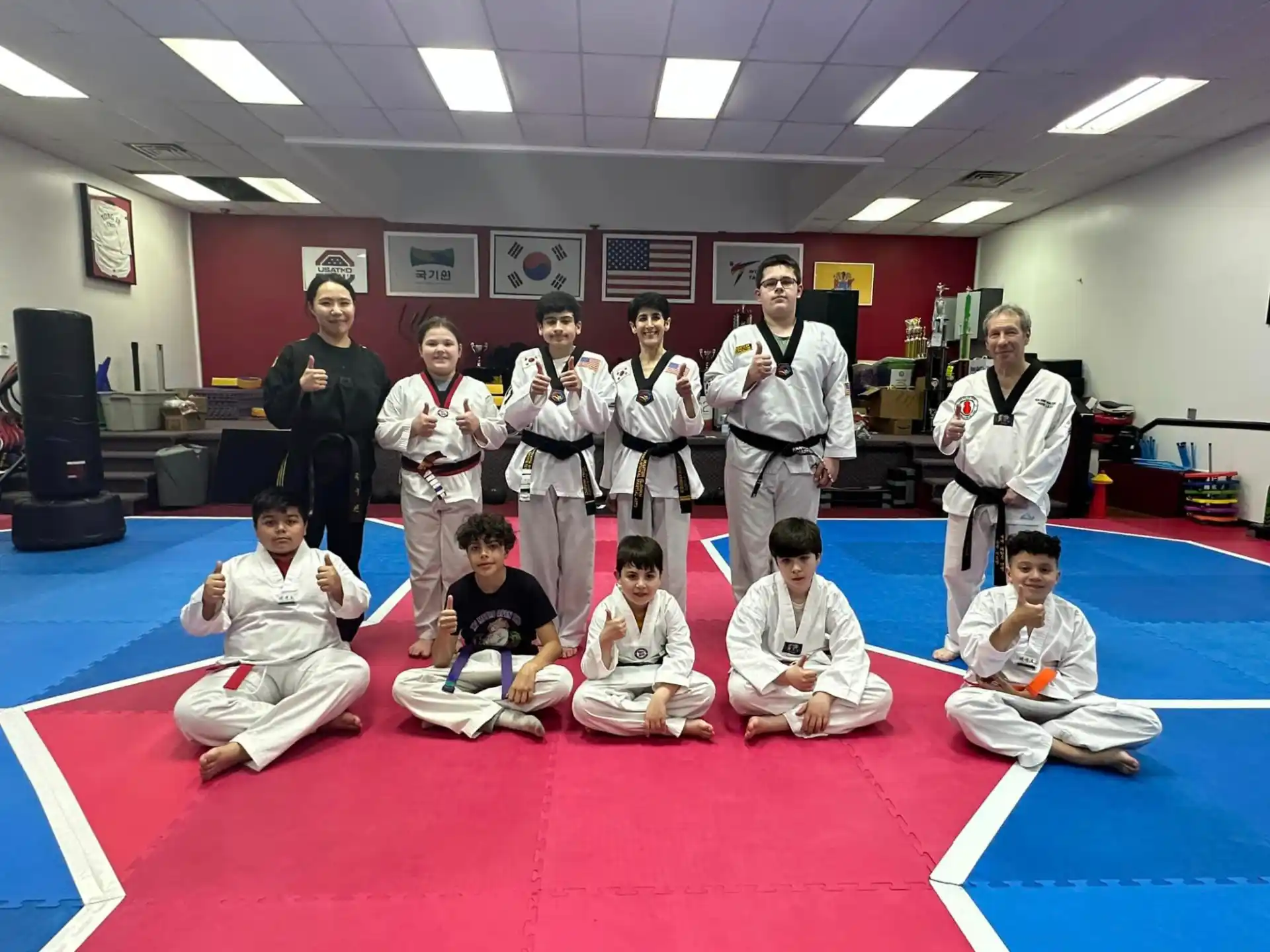 a group of people in karate uniforms