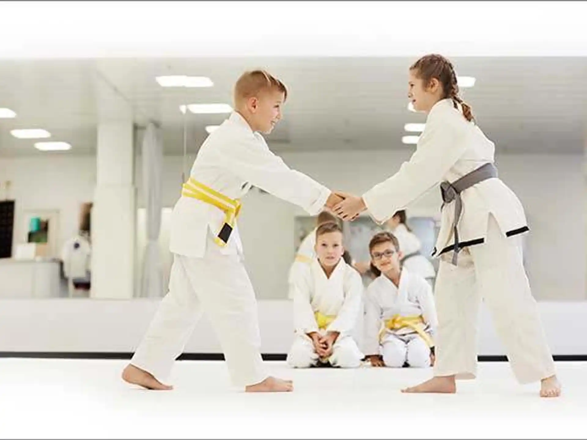 a group of people in karate uniforms