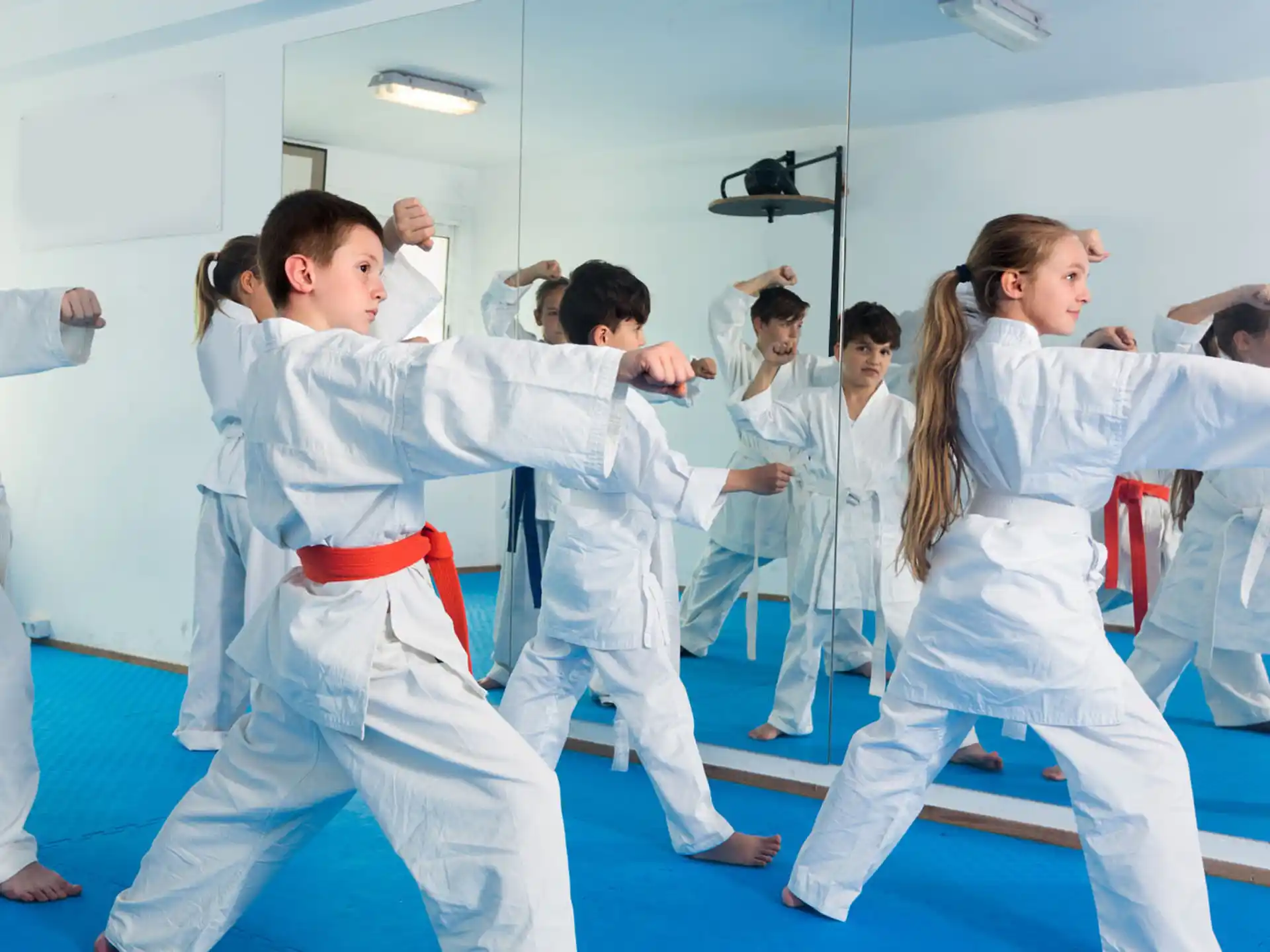 a group of people in karate uniforms