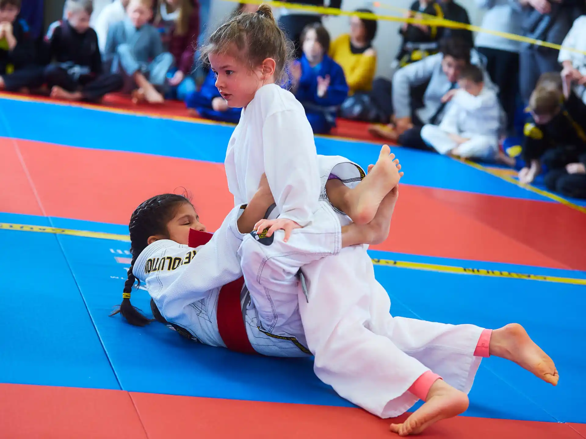 a couple of boys in karate uniforms