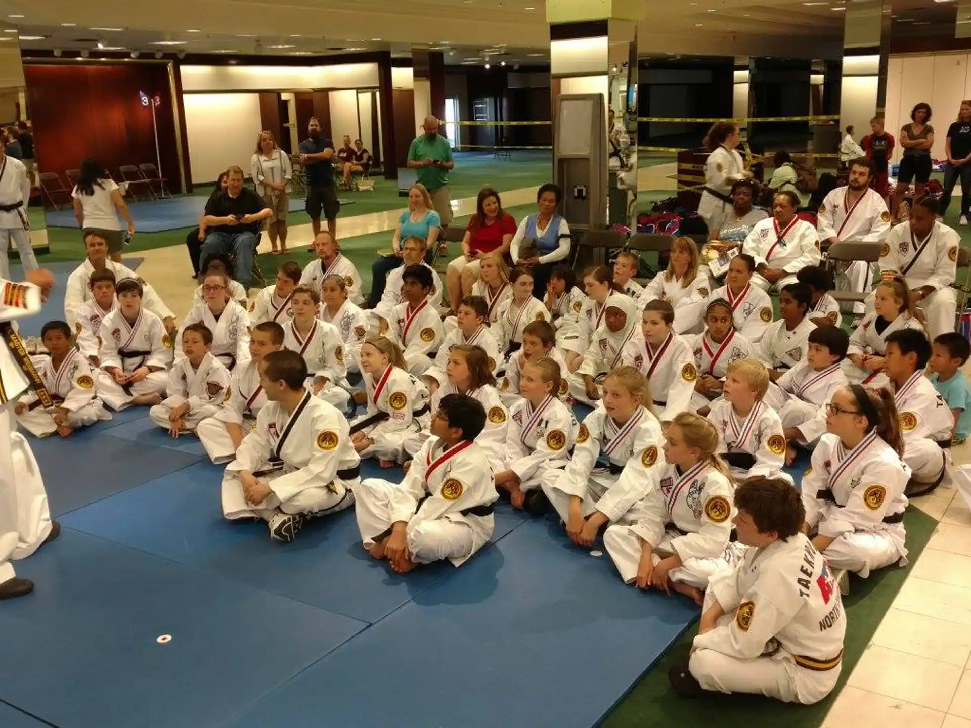 a group of people sitting on the floor