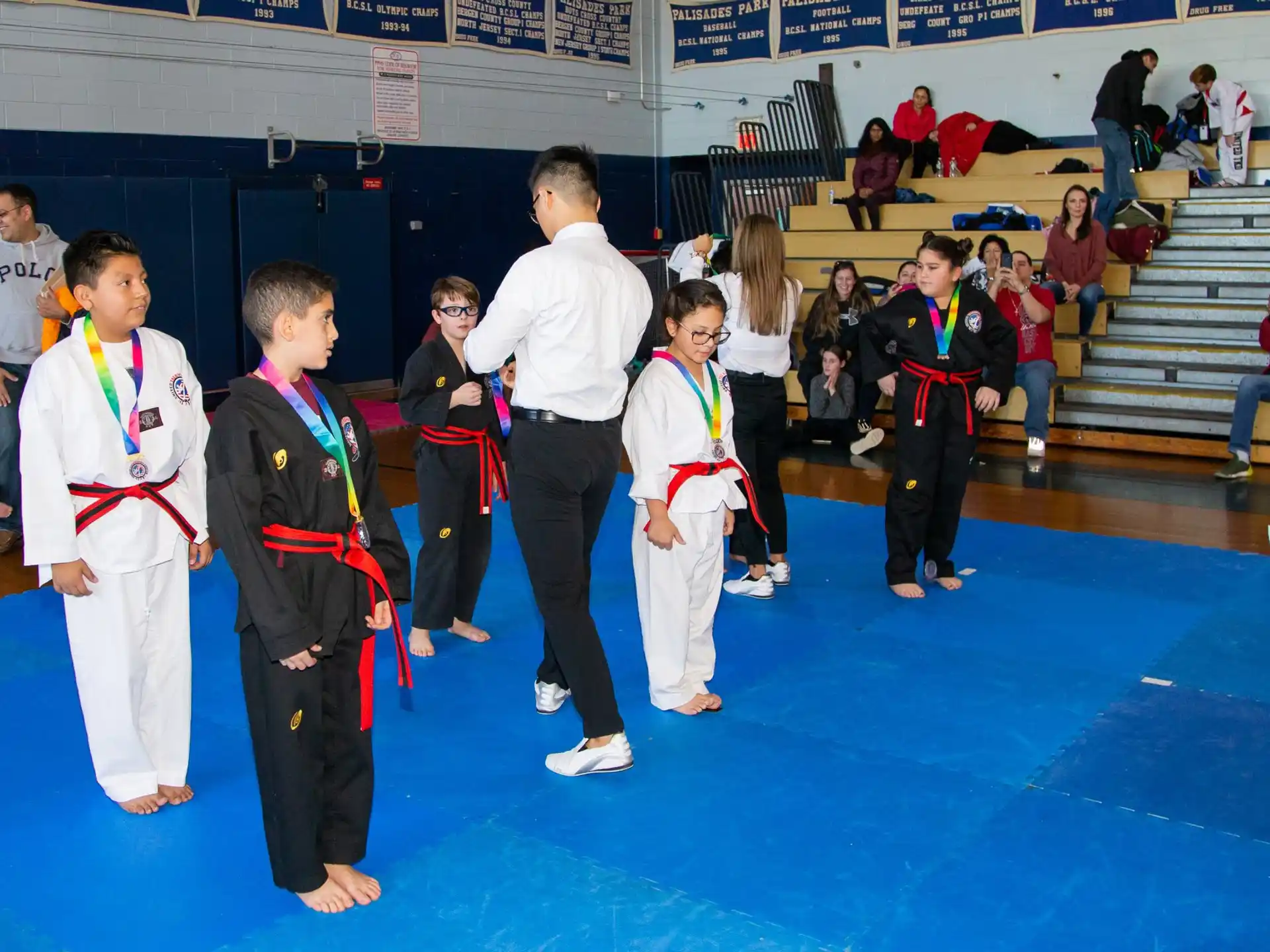 a group of children in karate uniforms