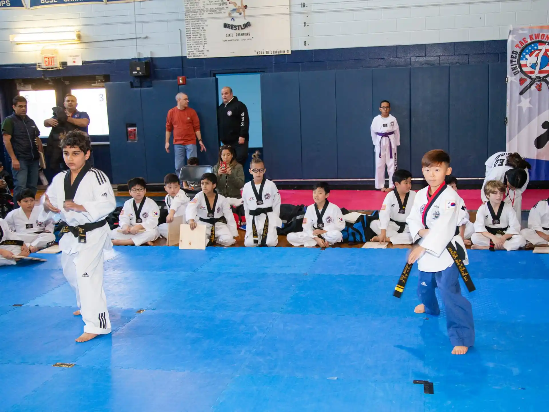 a group of kids in karate uniforms