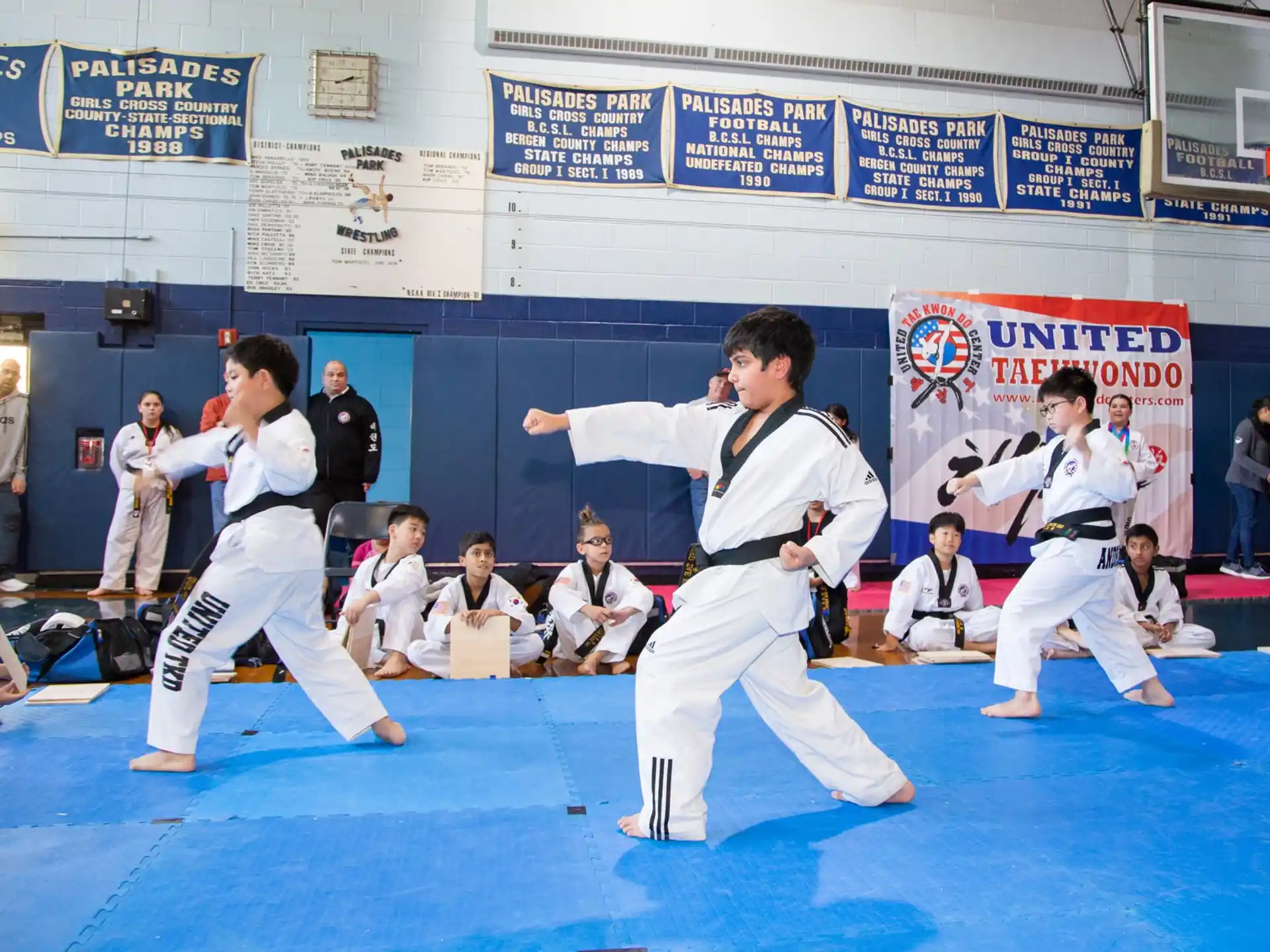 a group of people in karate uniforms