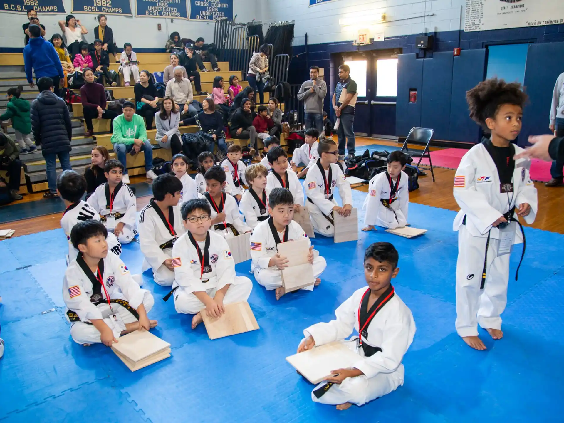 a group of people in karate uniforms
