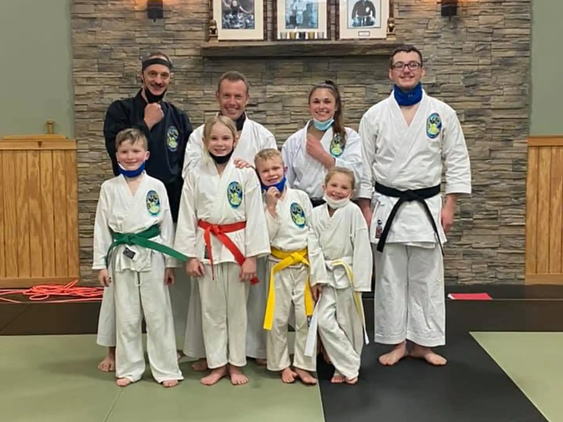 a group of people in karate uniforms