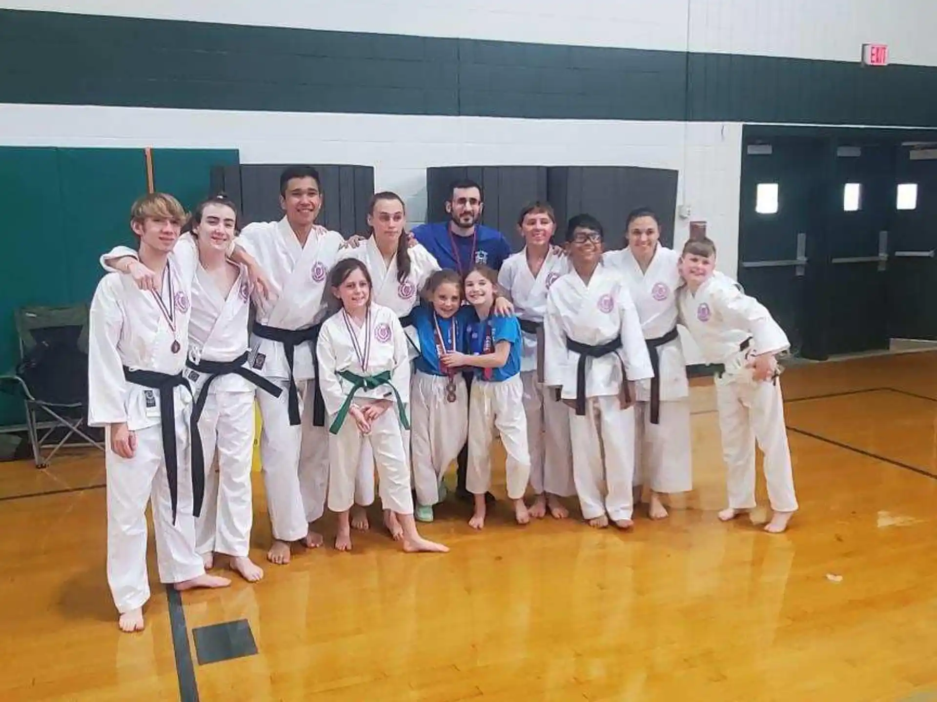 a group of people in karate uniforms