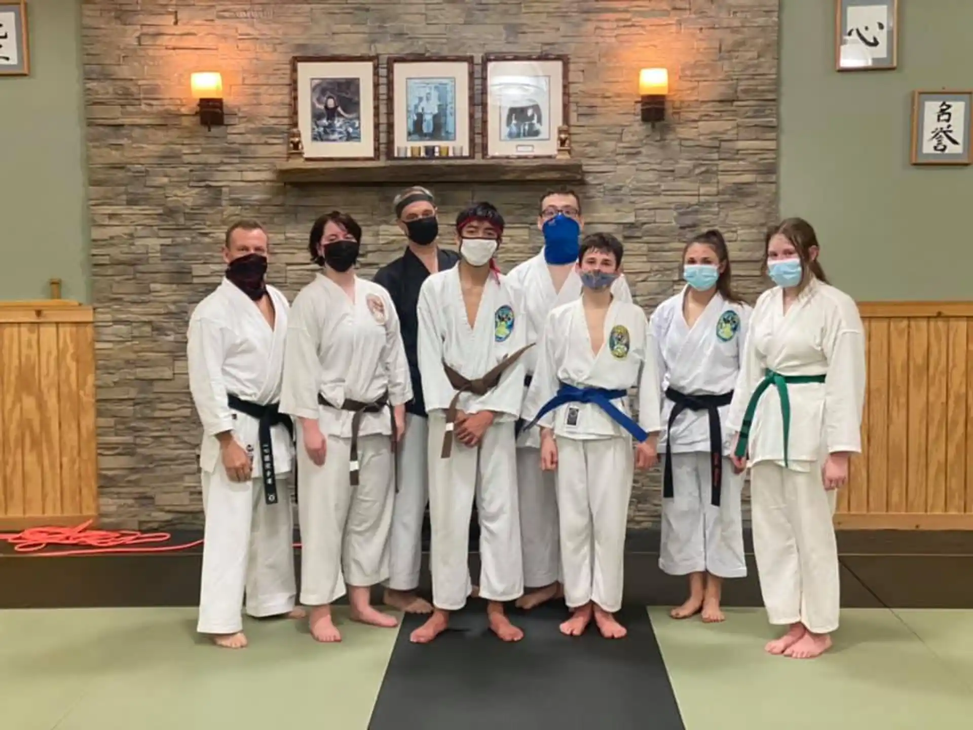 a group of people in white lab coats posing for a photo