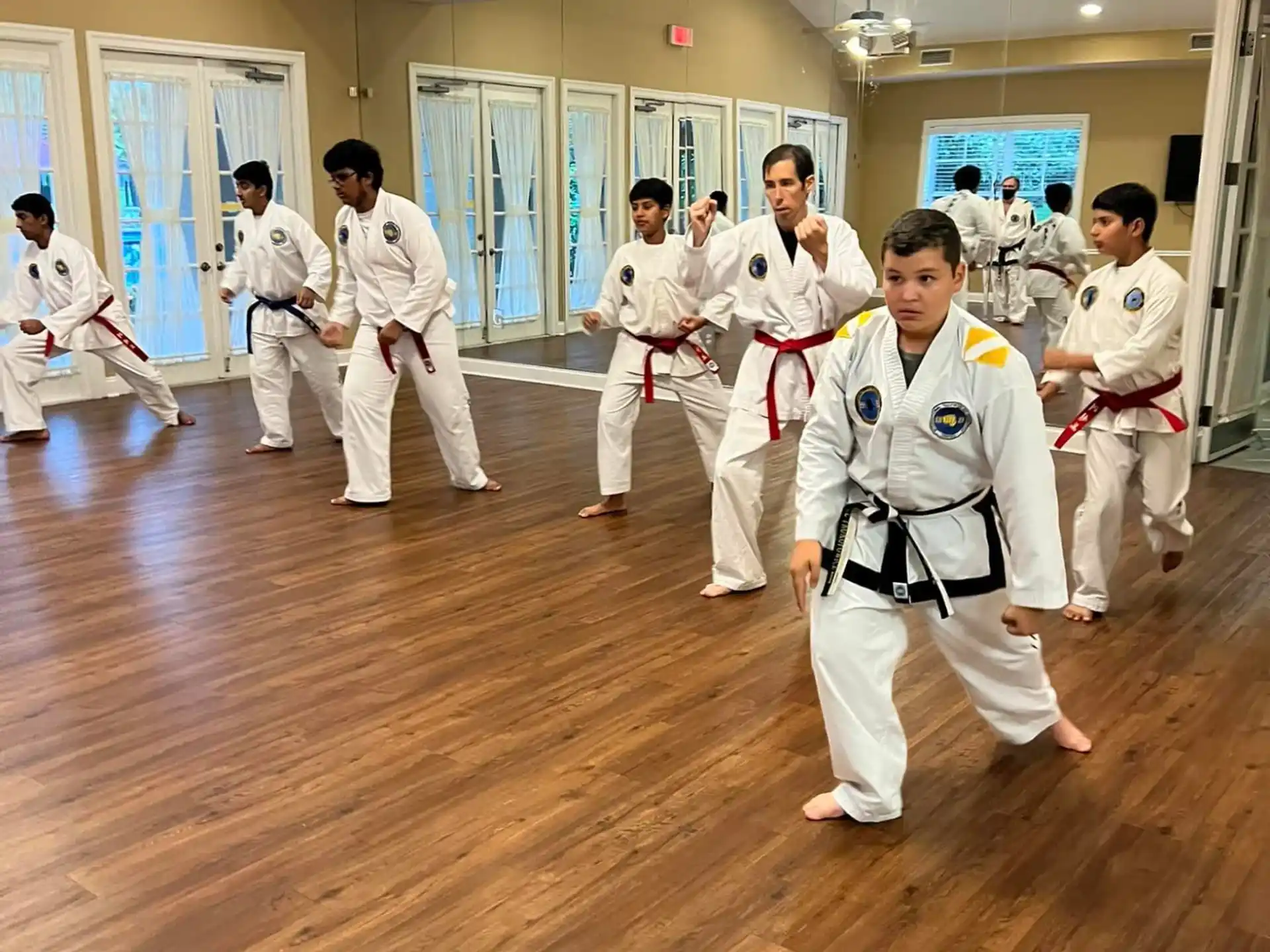 a group of people in karate uniforms