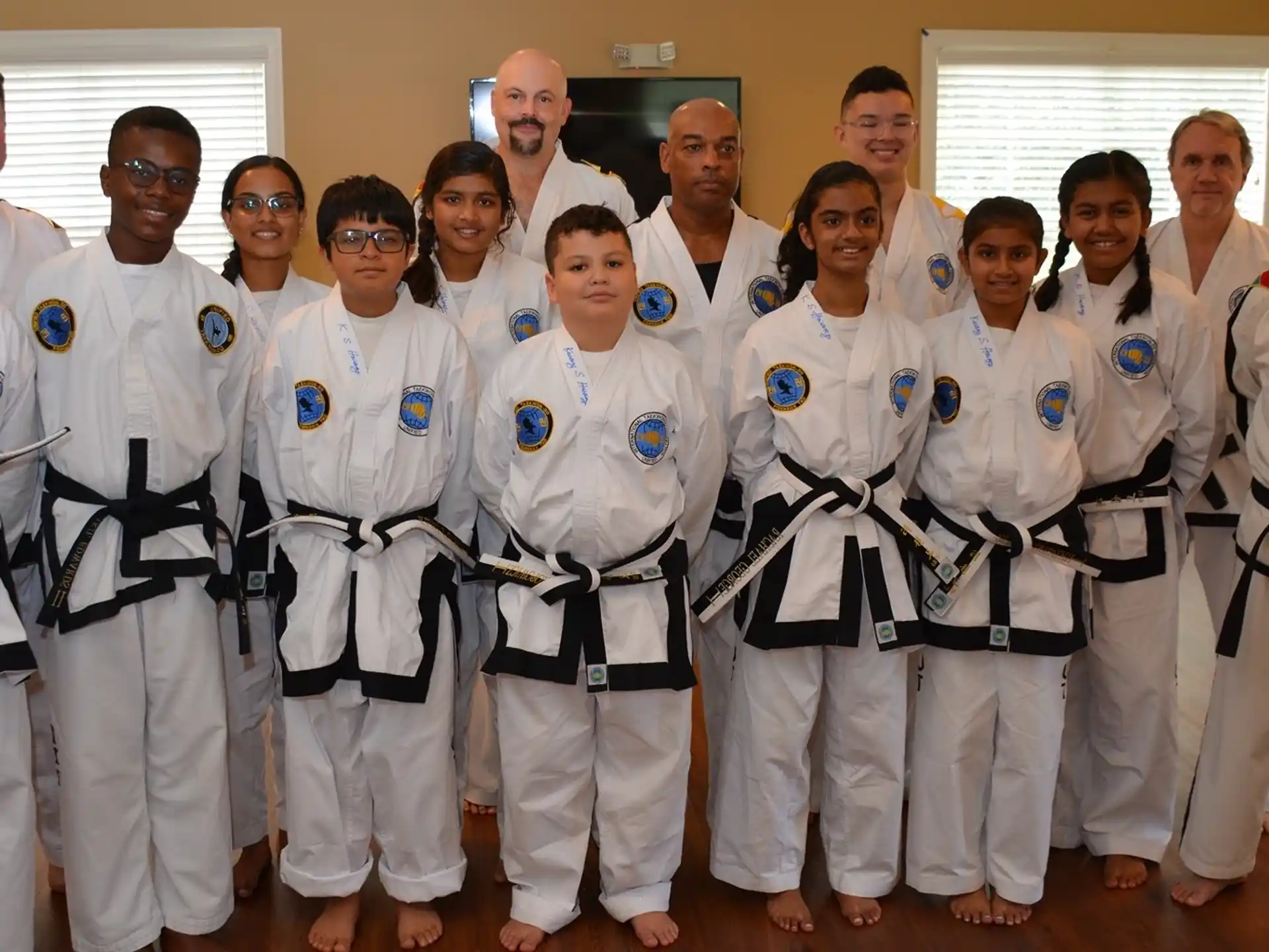 a group of people in white jumpsuits