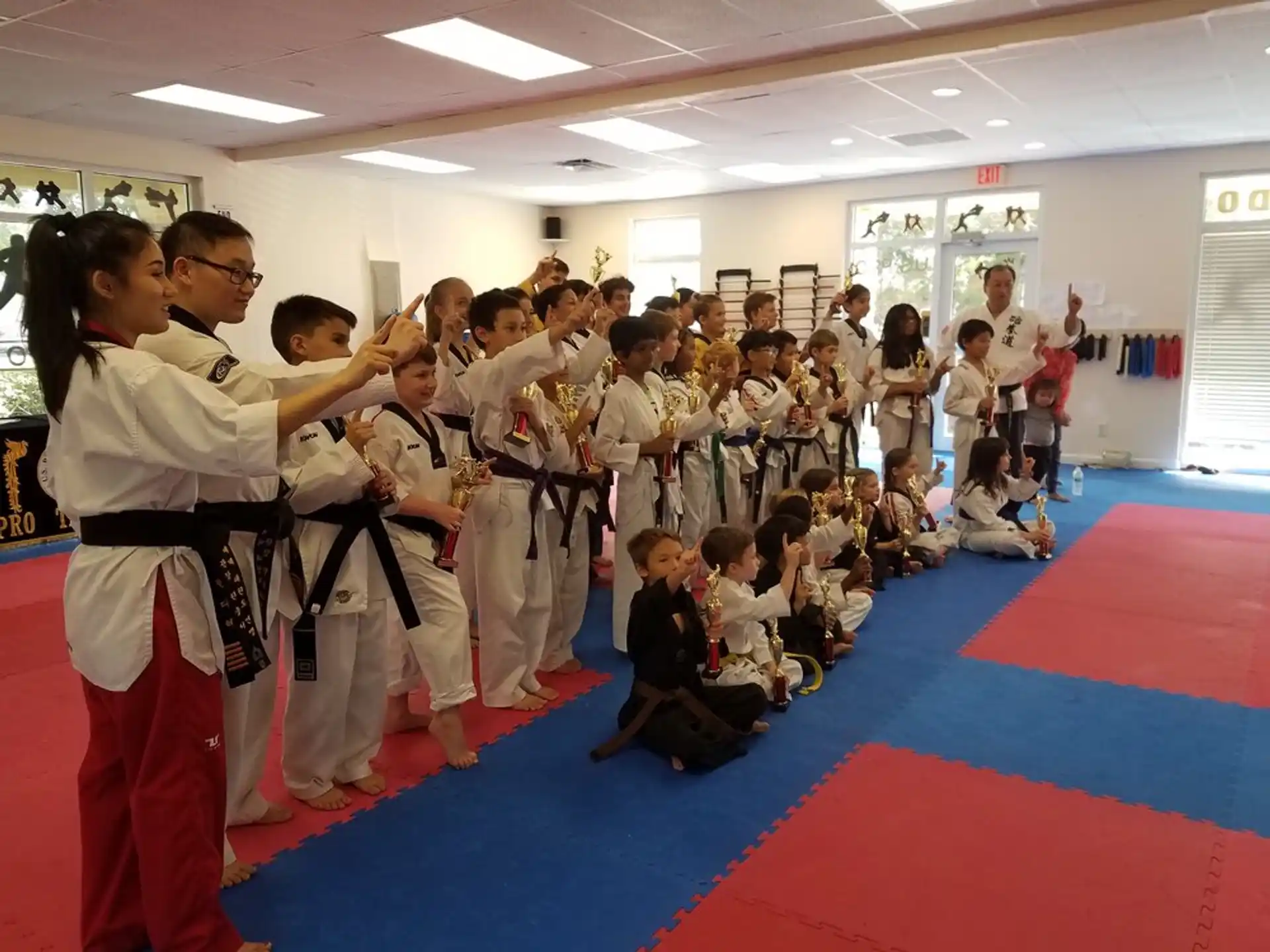 a group of people in karate uniforms