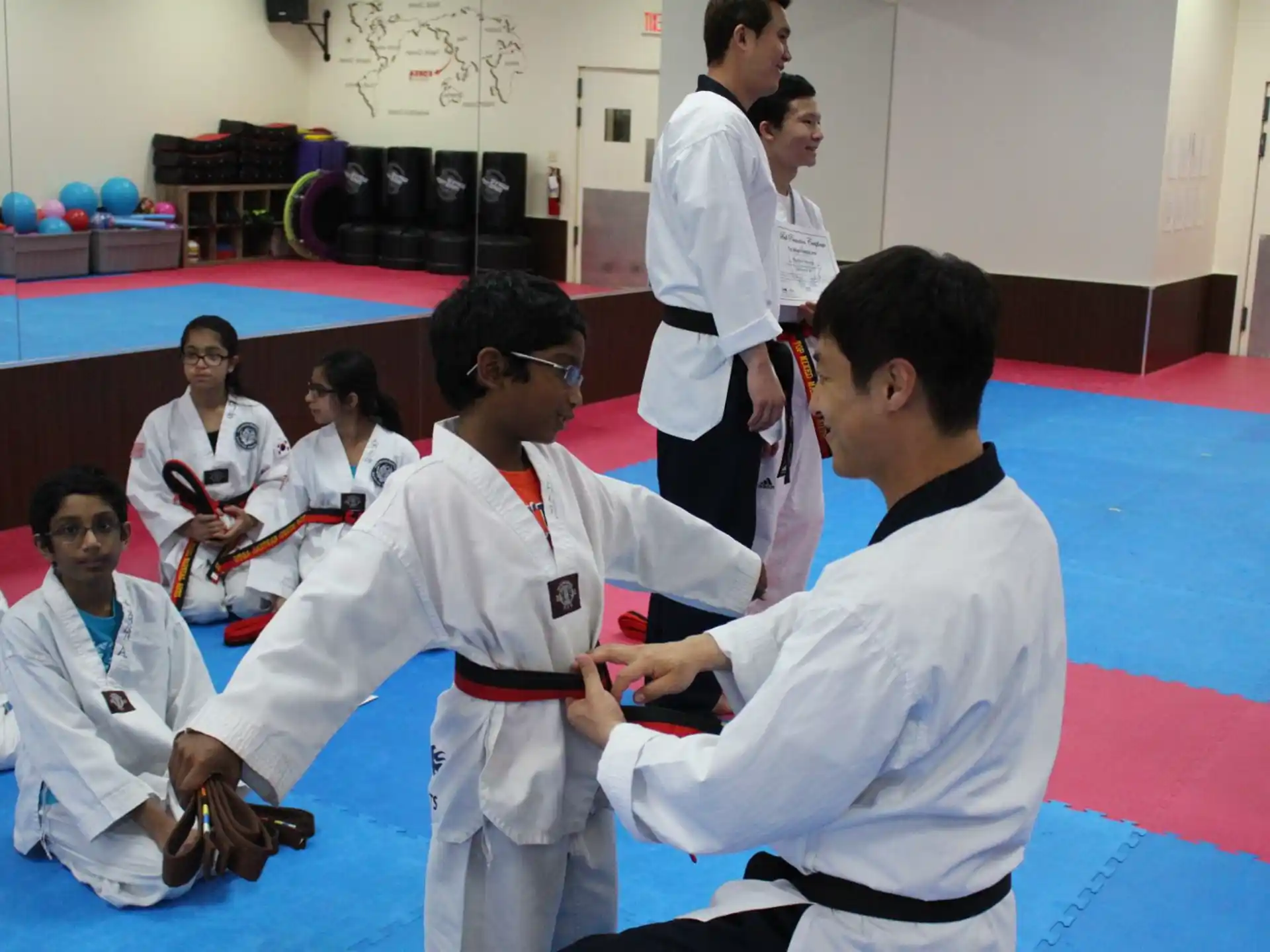 a group of people in karate uniforms