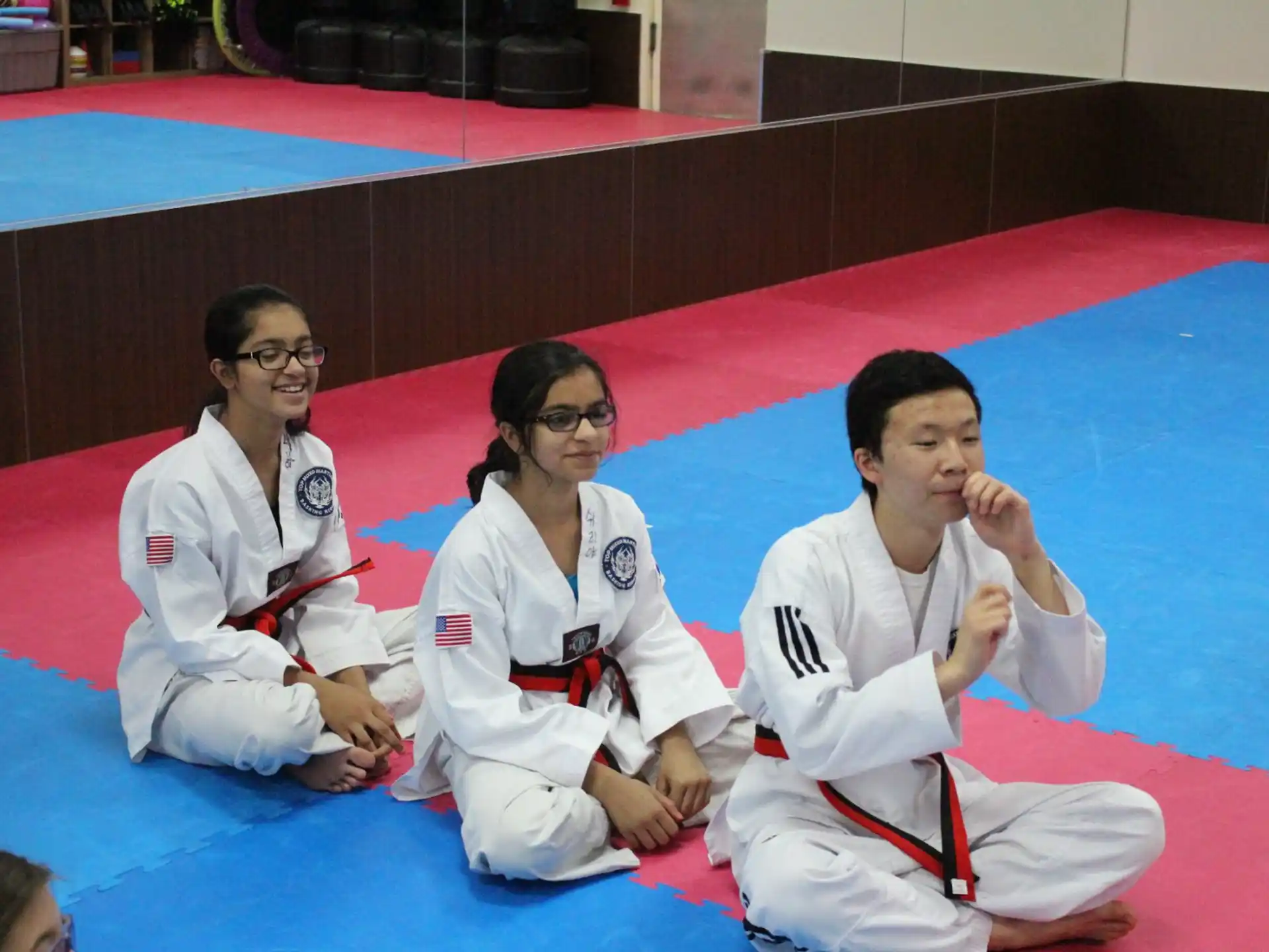 a group of people in karate uniforms