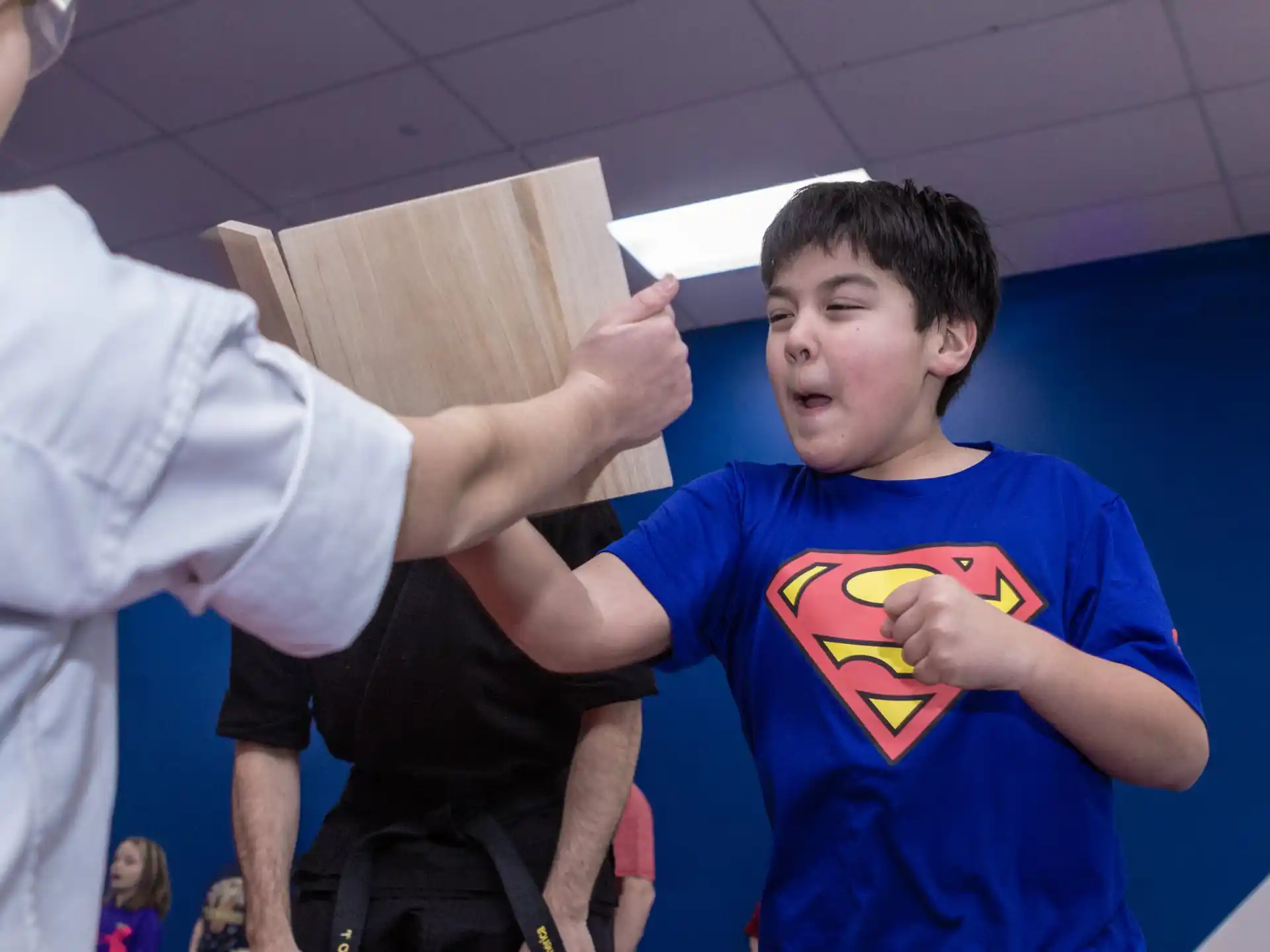 a person holding a wooden board