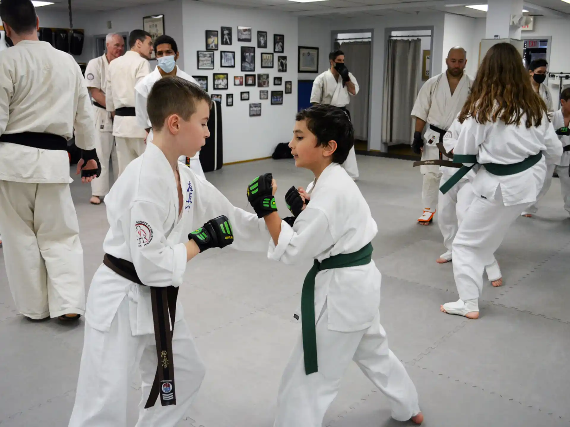 a group of people in karate uniforms