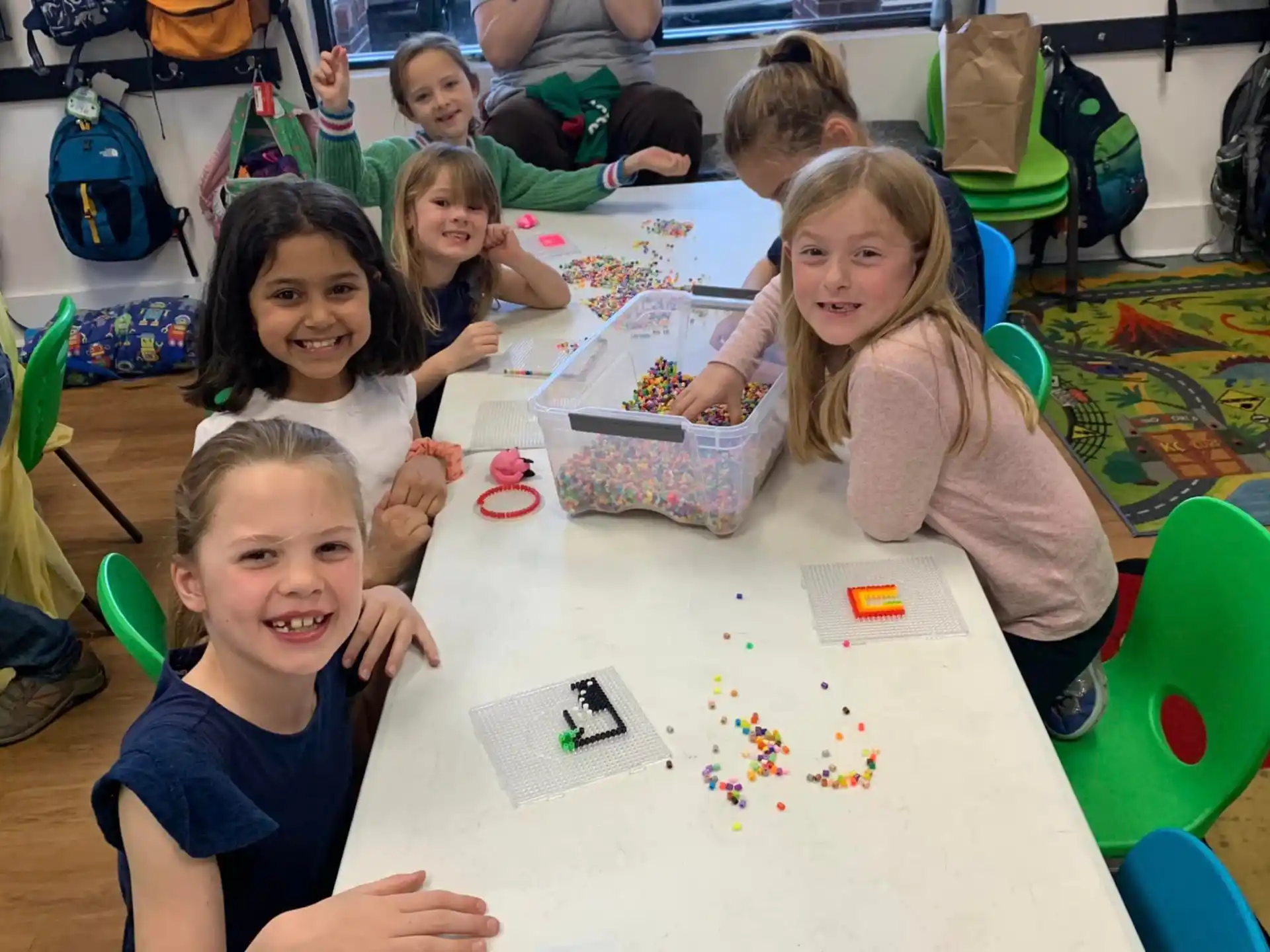a group of children sitting at a table