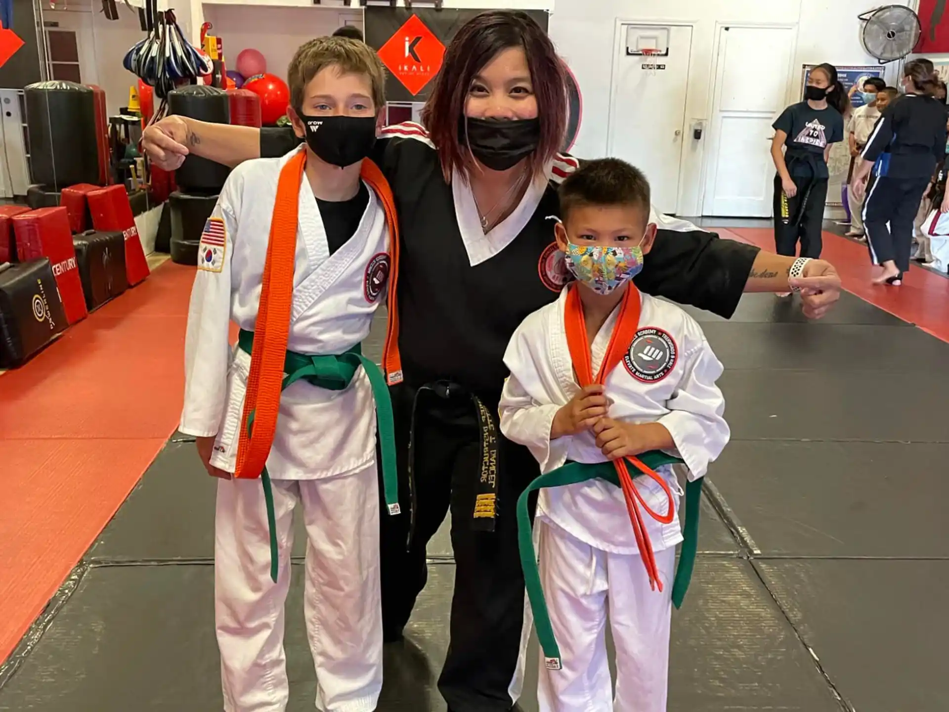 a group of people in karate uniforms