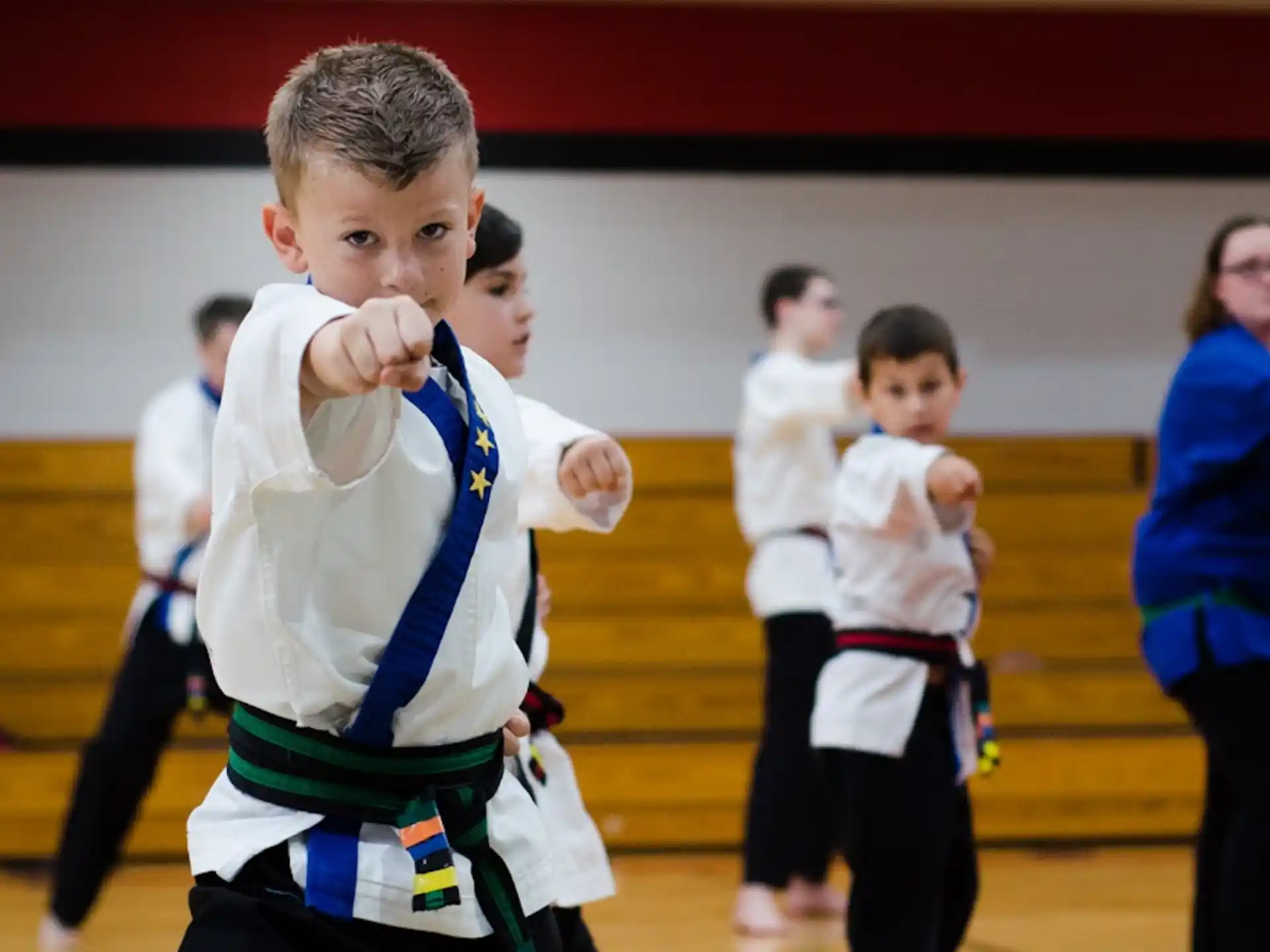 a boy in a karate uniform