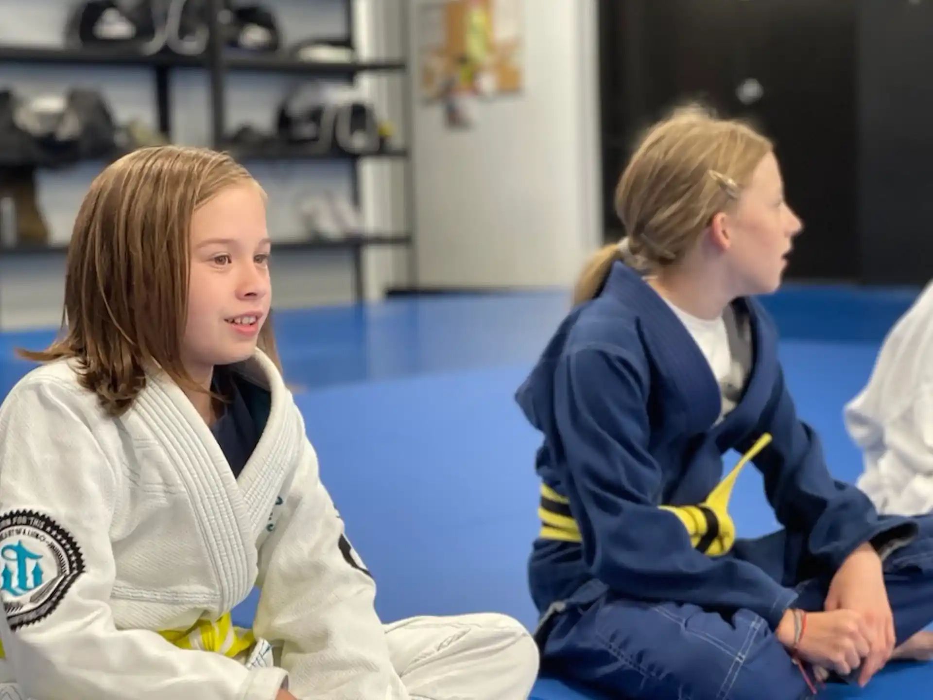 a person sitting next to another woman