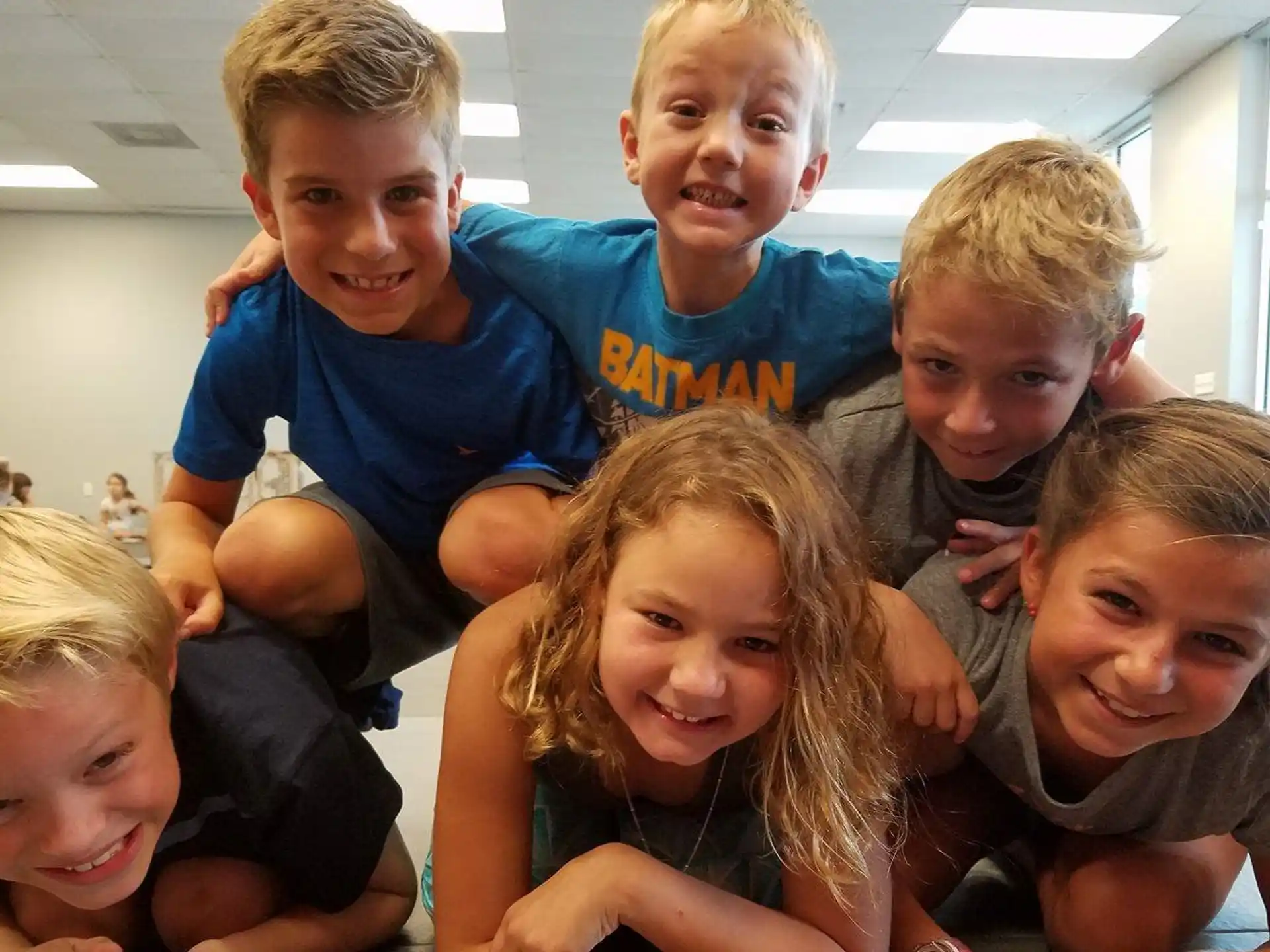 a group of children posing for a photo