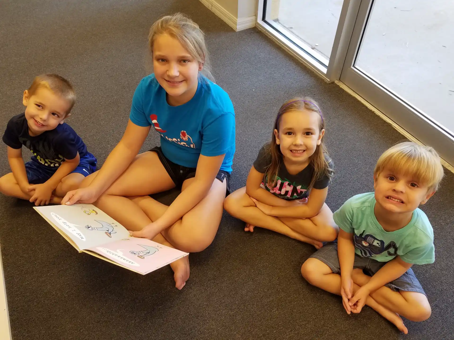 a group of children sitting on the floor