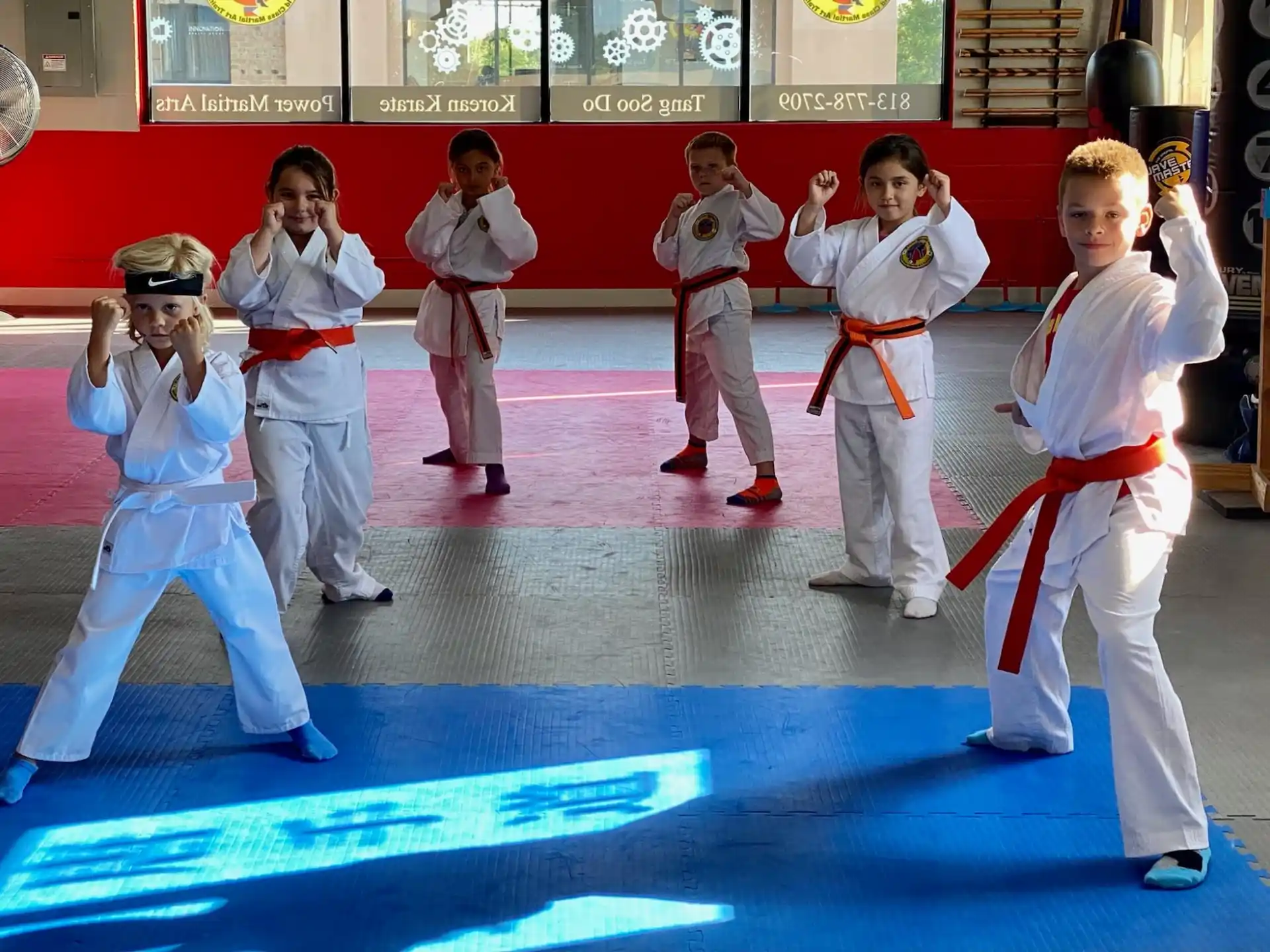 a group of people in karate uniforms
