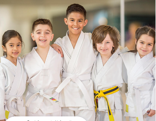 a group of children wearing white lab coats