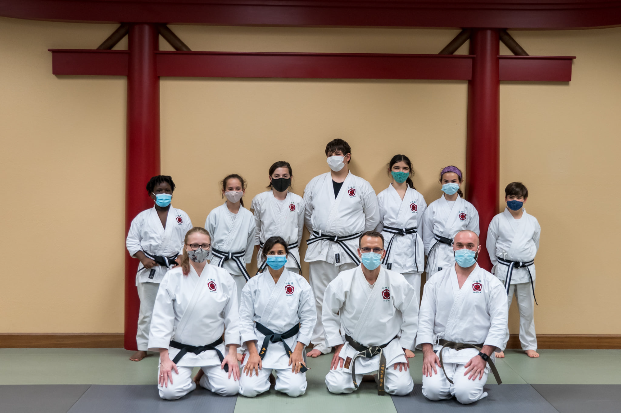 a group of people wearing white uniforms