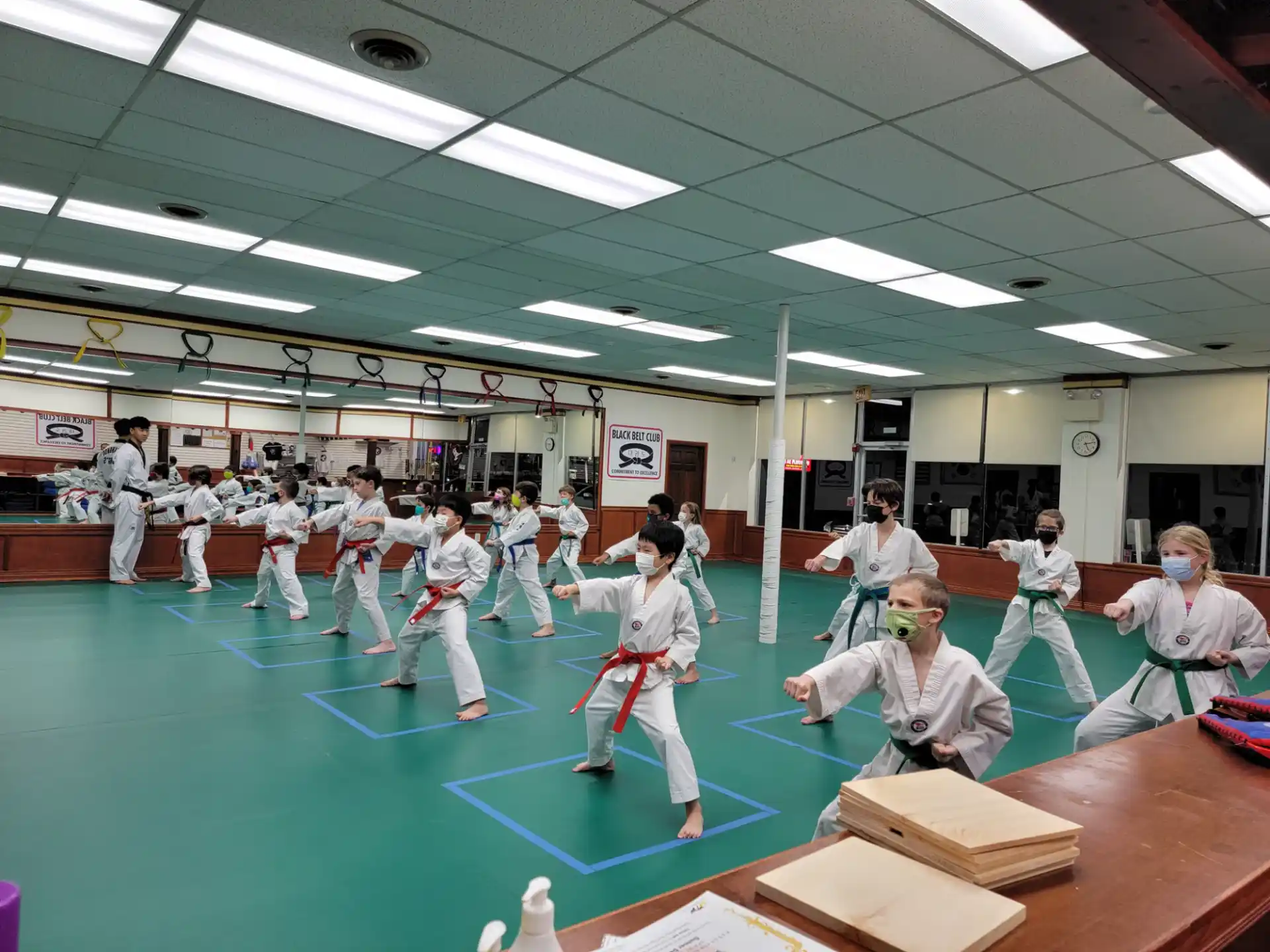 a group of people in karate uniforms