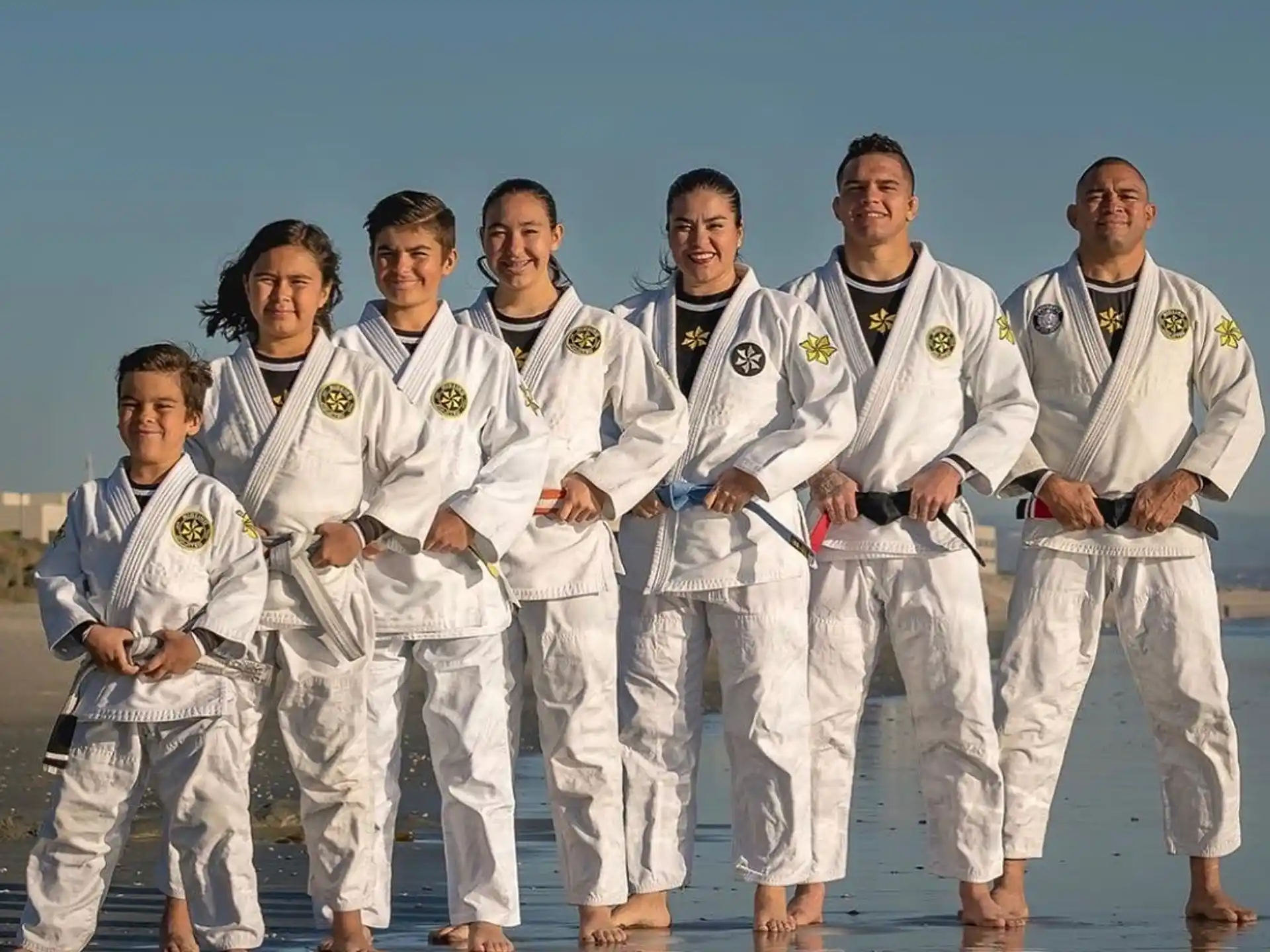 a group of people wearing white karate uniforms