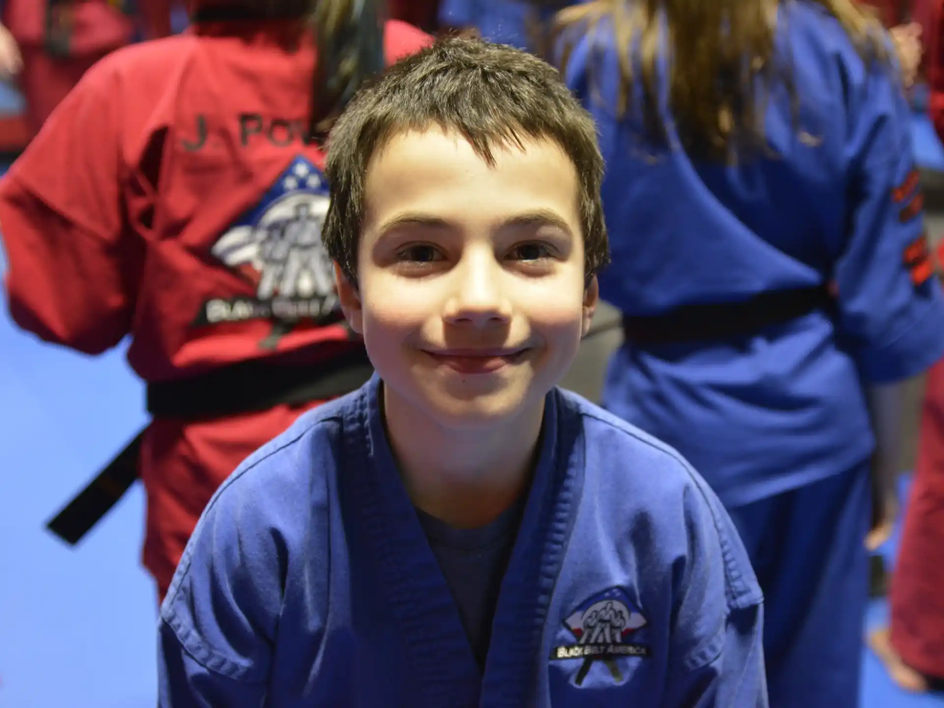 a boy smiling for the camera