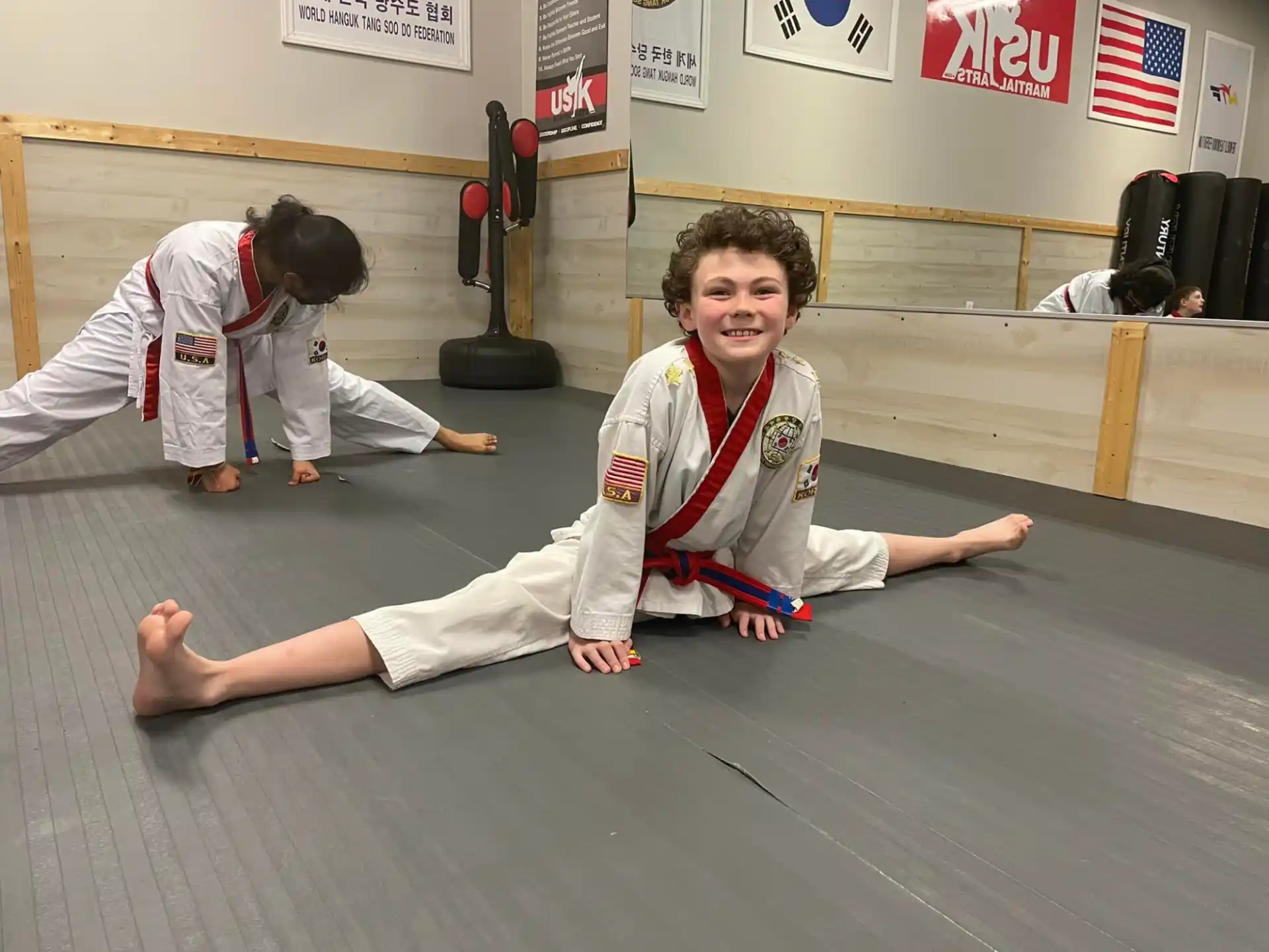 a boy in a karate uniform