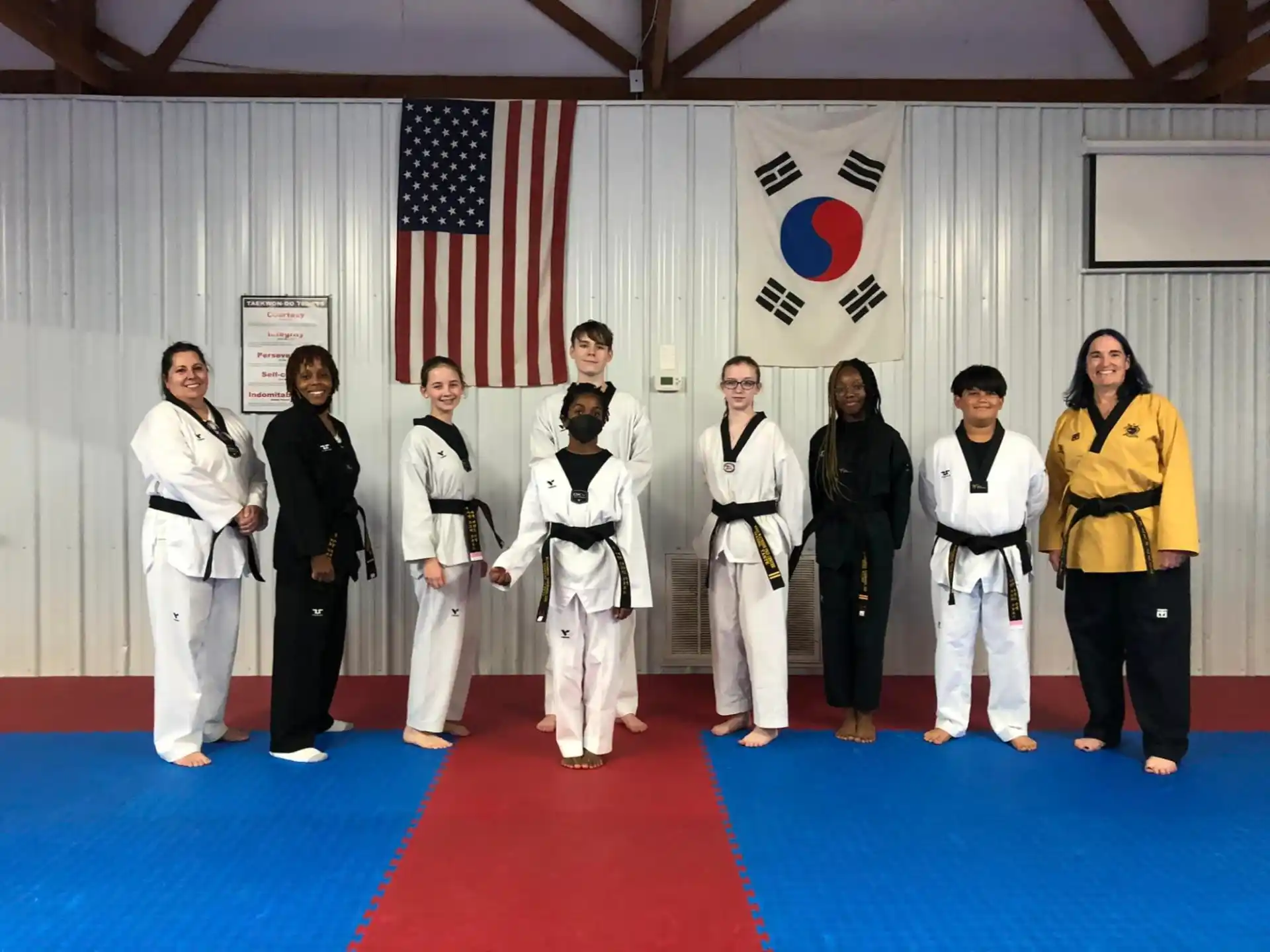 a group of people in karate uniforms