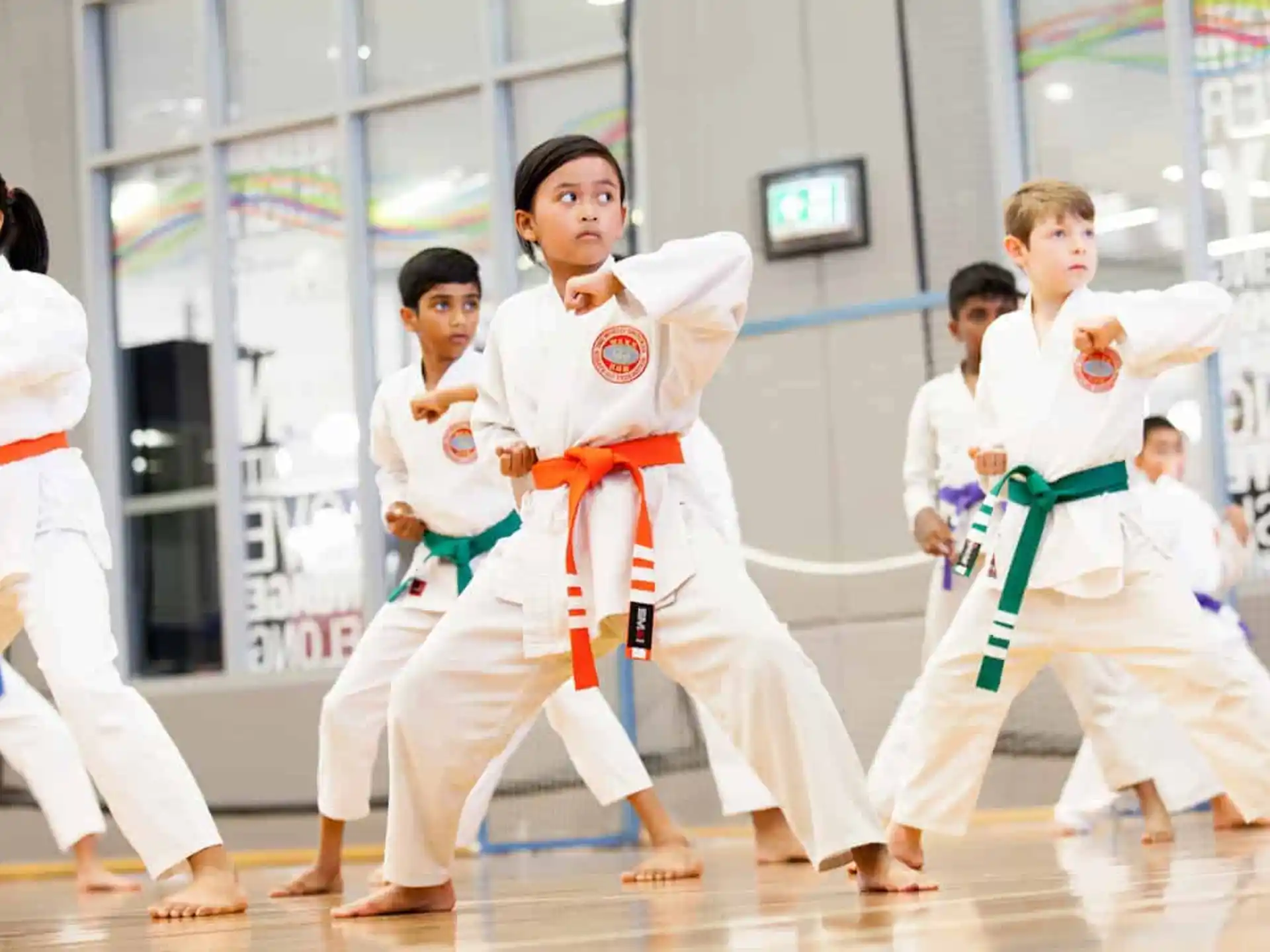 a group of people in karate uniforms