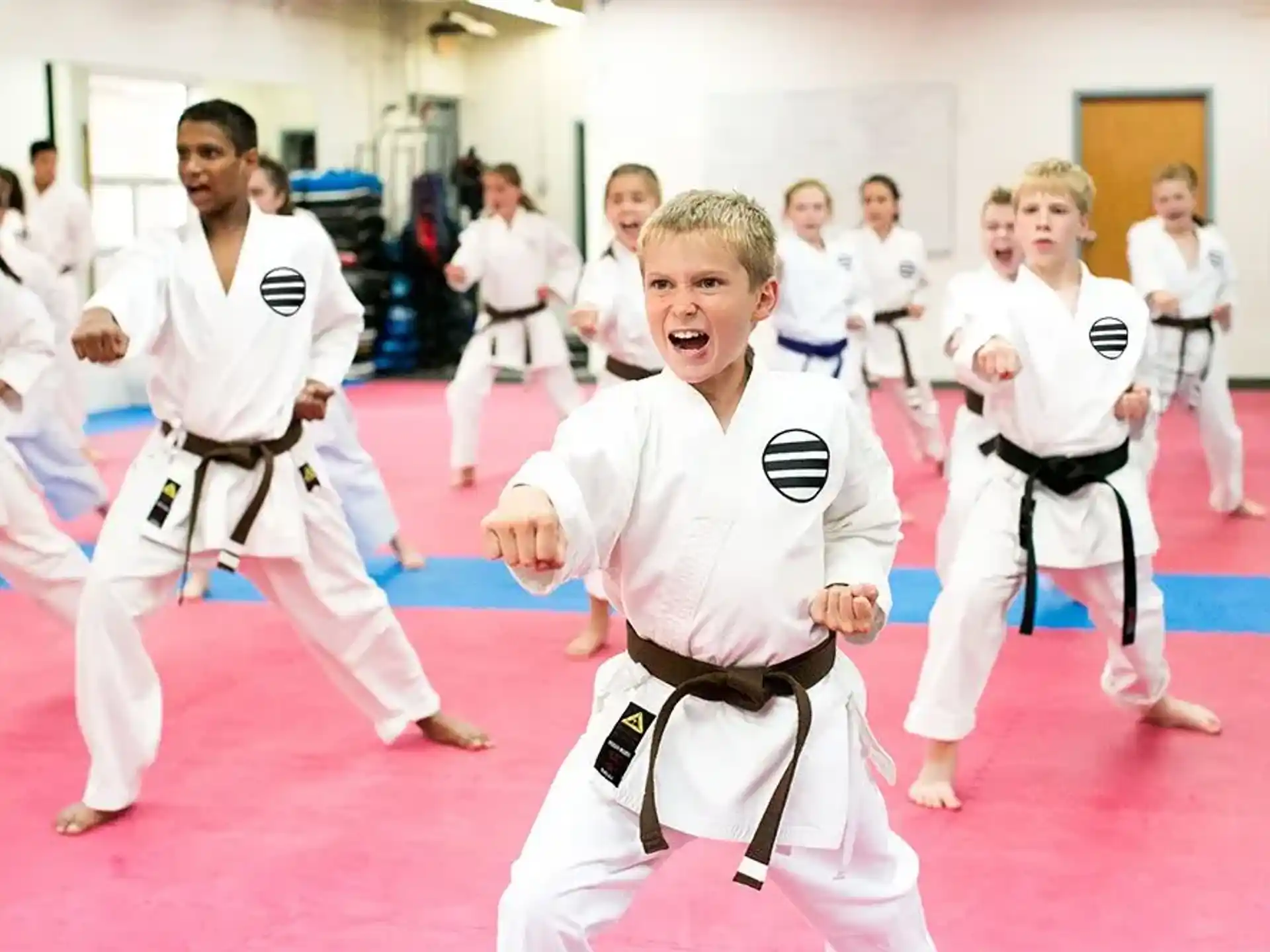a group of people in karate uniforms